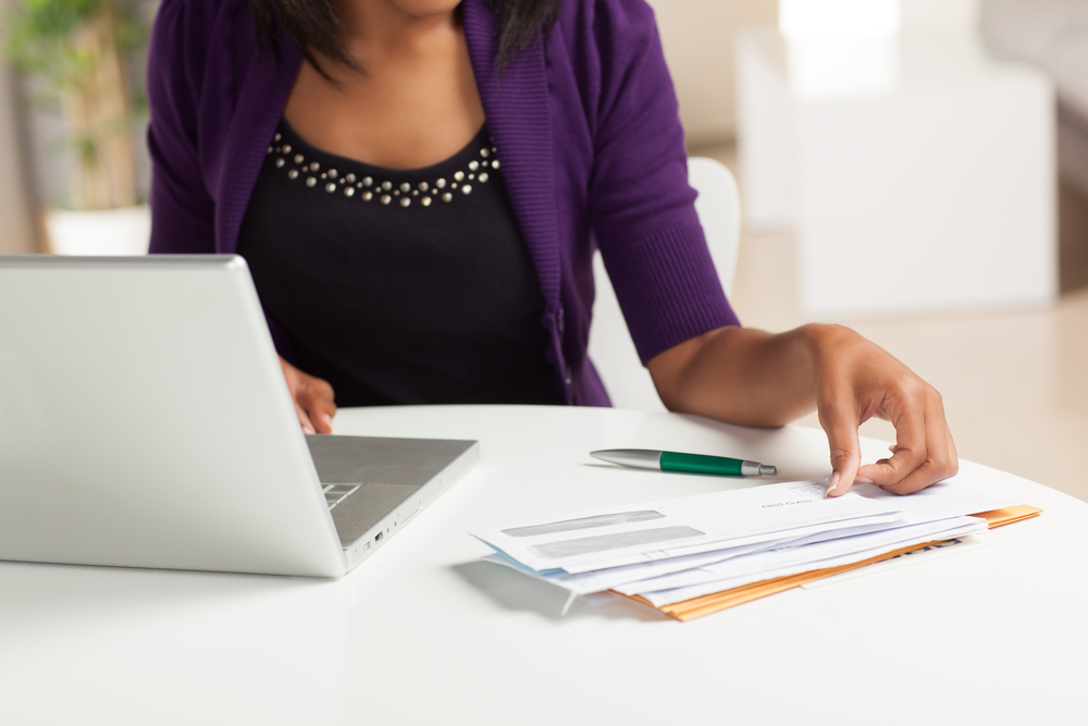 Woman working on finances at home