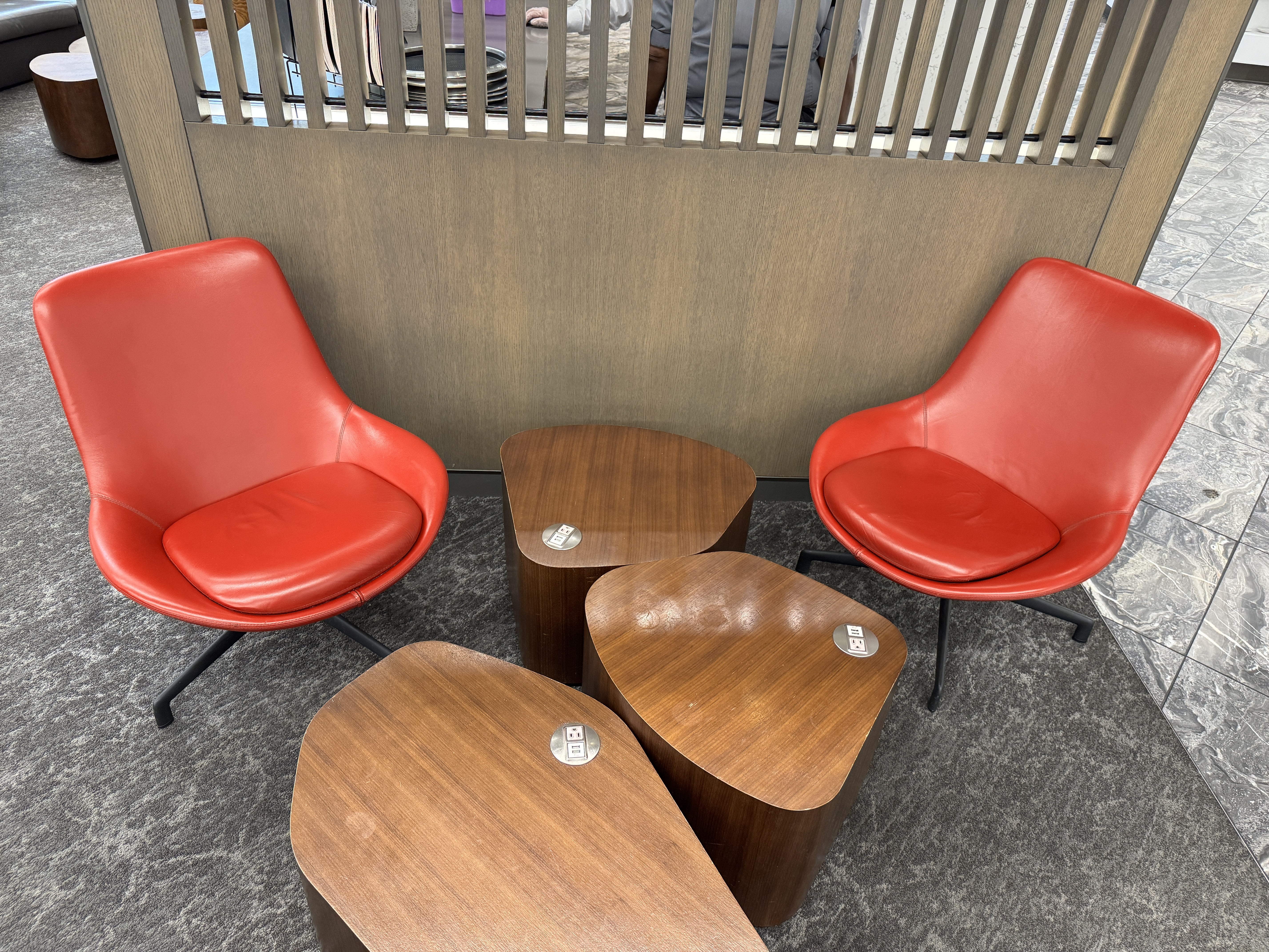 Air Canada Maple Leaf Lounge LGA seating with powered wooden tables Air Canada Maple Leaf Lounge LGA seating with powered wooden tables