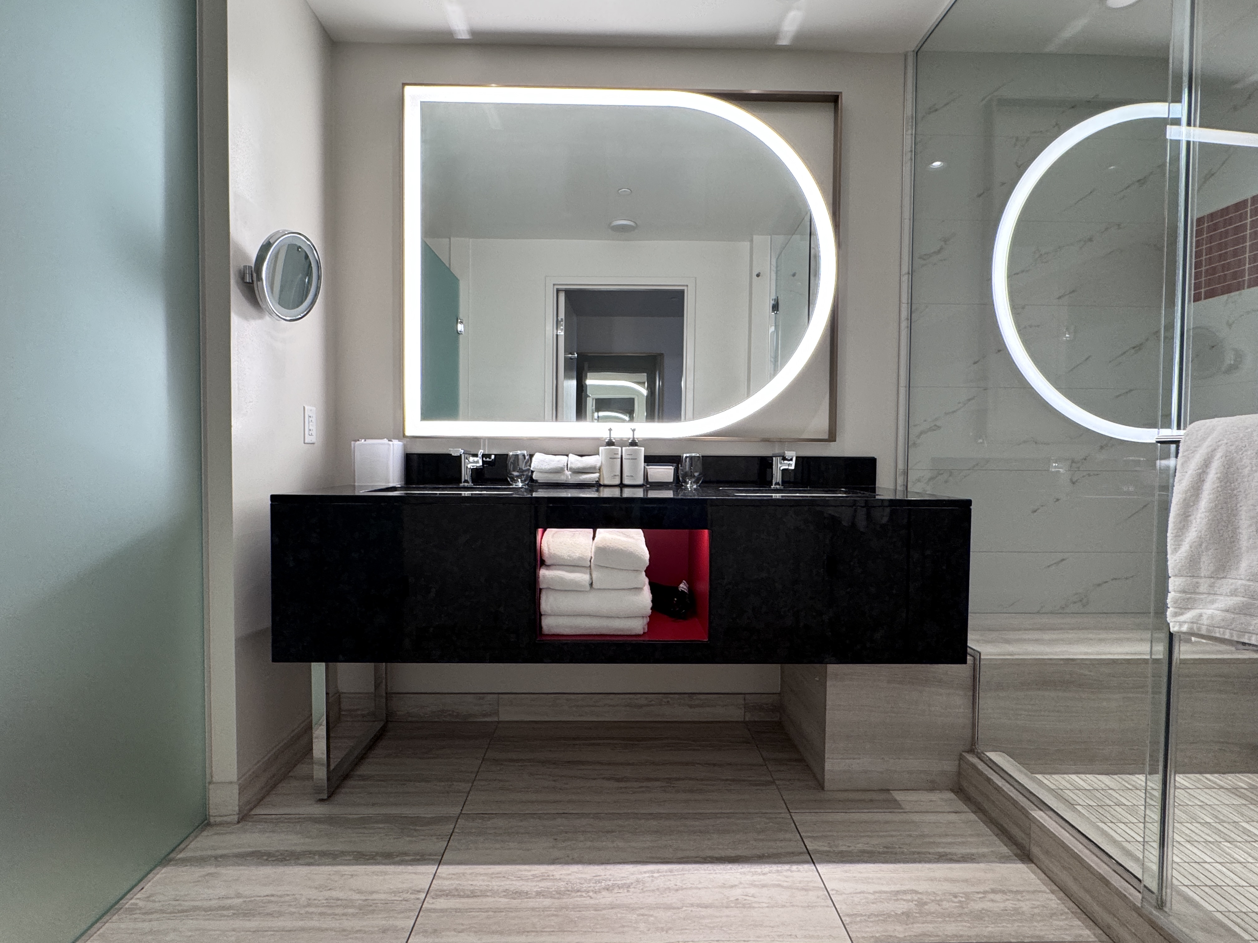 Conrad Las Vegas king room bathroom double vanity with lit oval mirror