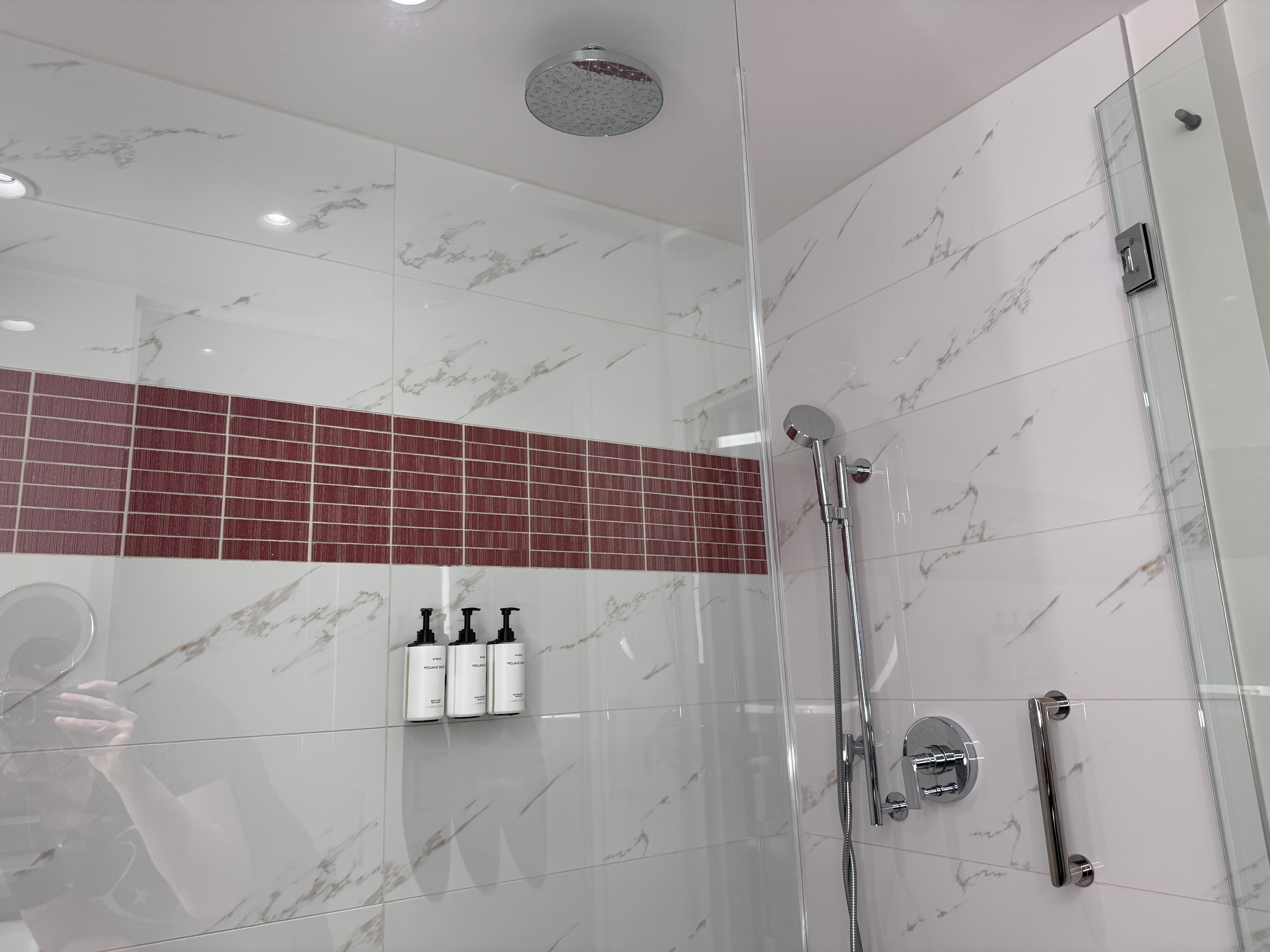 Conrad Las Vegas king room walk in shower with rain head and red tile