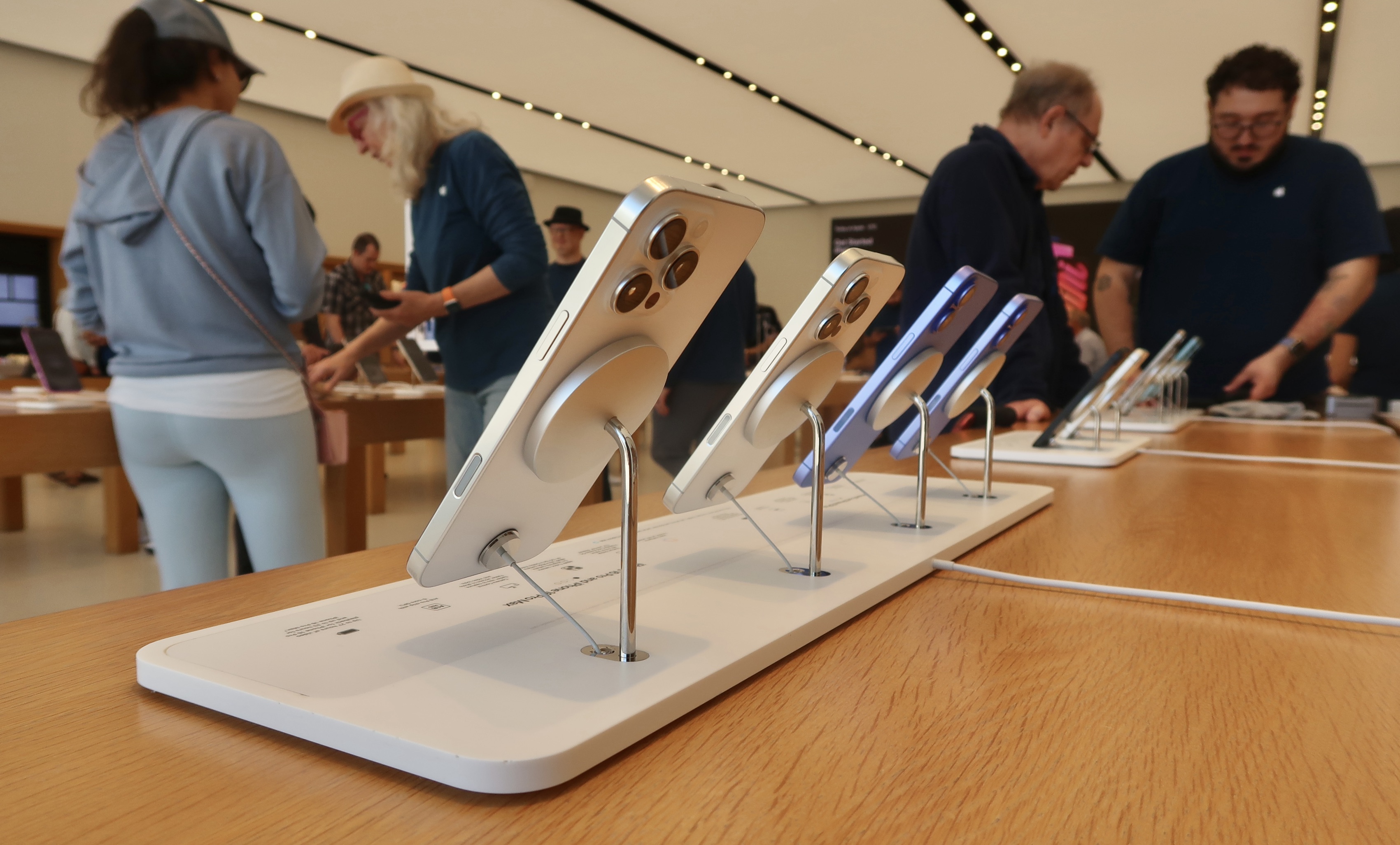 Interior of Apple Store With iPhones Lined Up Upgraded Points LLC 3