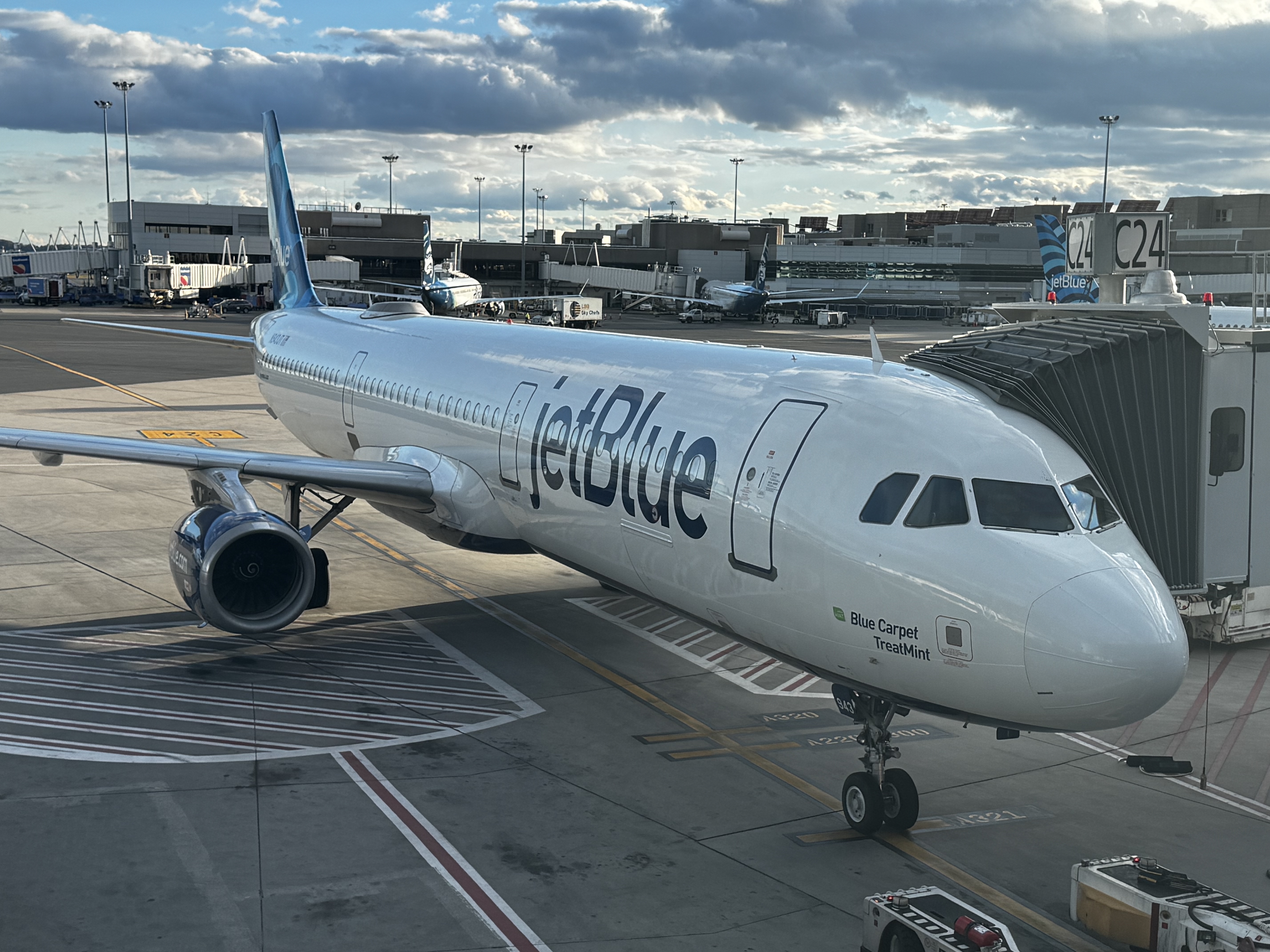JetBlue A220 at gate BOS closeup JetBlue A220 at gate BOS closeup