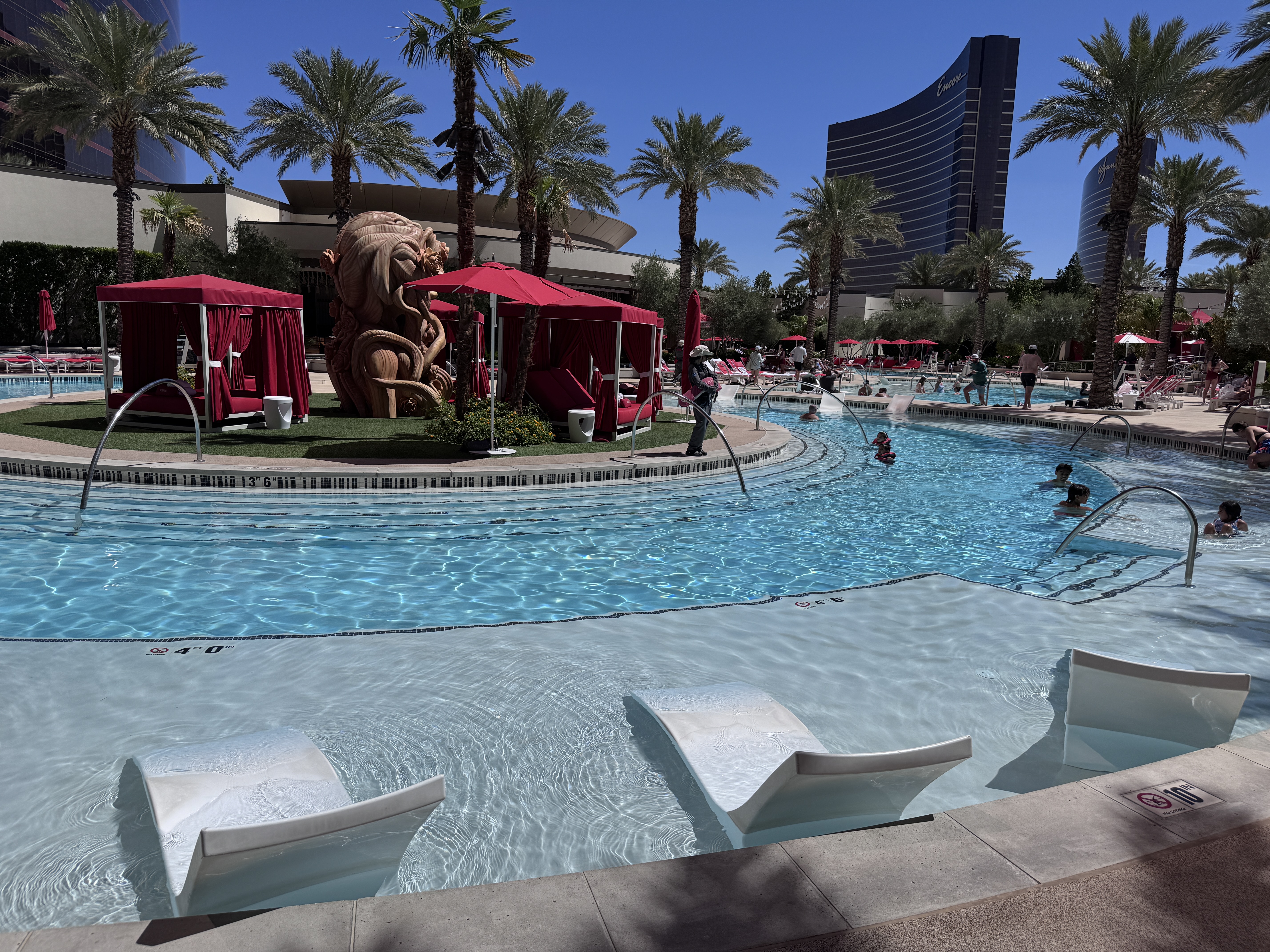 Resorts World Las Vegas pool main pool with island cabanas and dragon sculpture