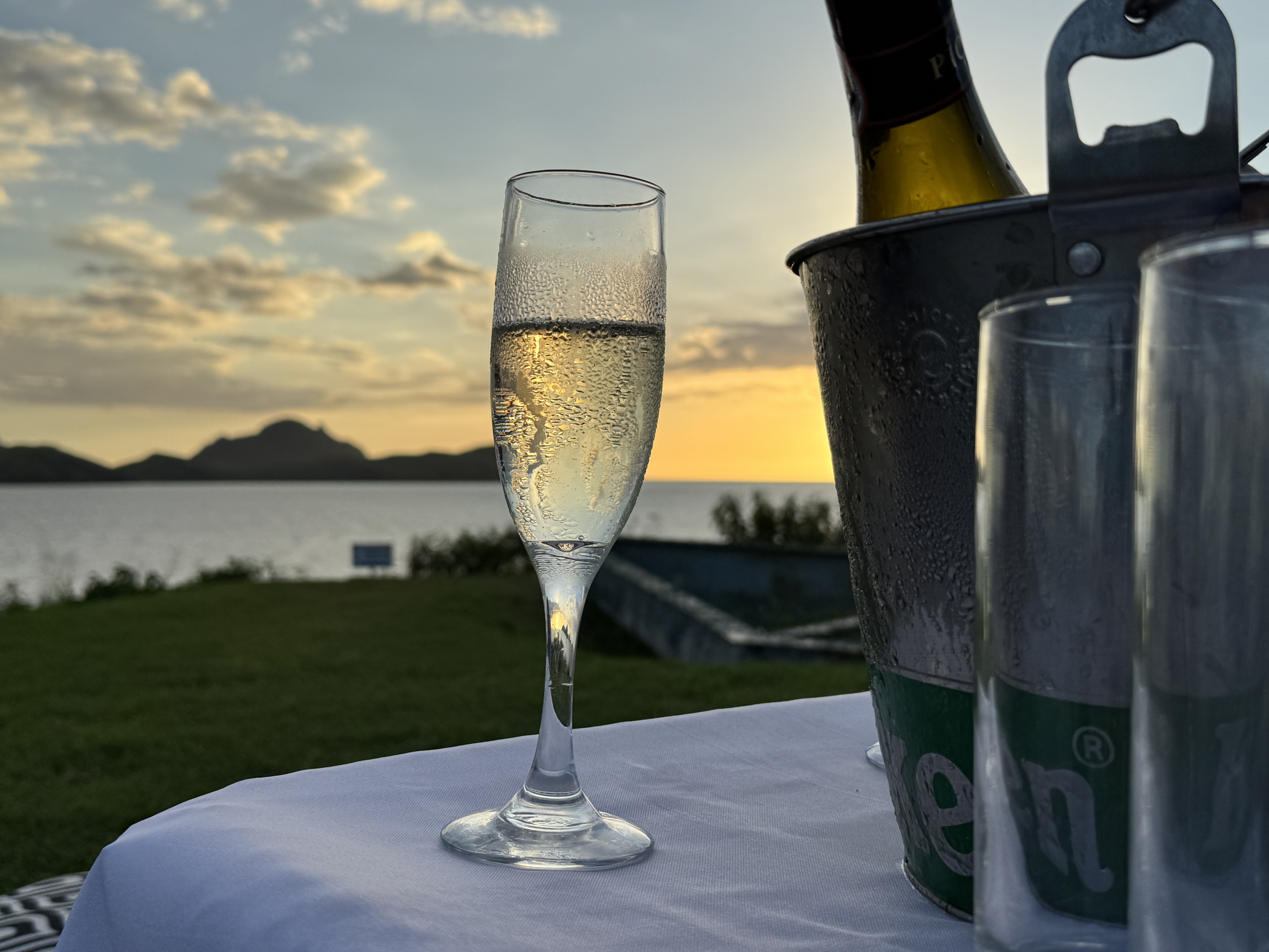 Sheraton Tokoriki Island Champagne flute ice bucket at sunset over the ocean Sheraton Tokoriki Island Champagne flute ice bucket at sunset over the ocean