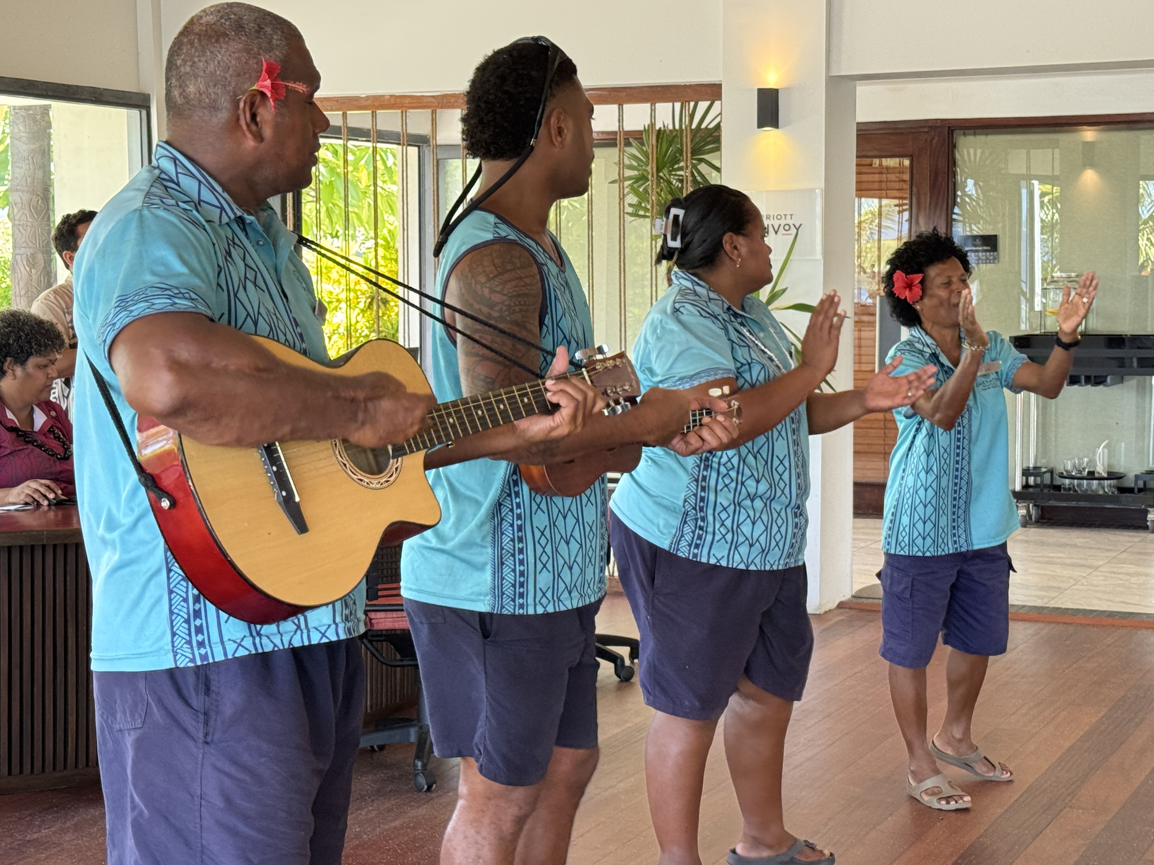 Sheraton Tokoriki Island Fijian staff performing traditional welcome song with guitar Sheraton Tokoriki Island Fijian staff performing traditional welcome song with guitar