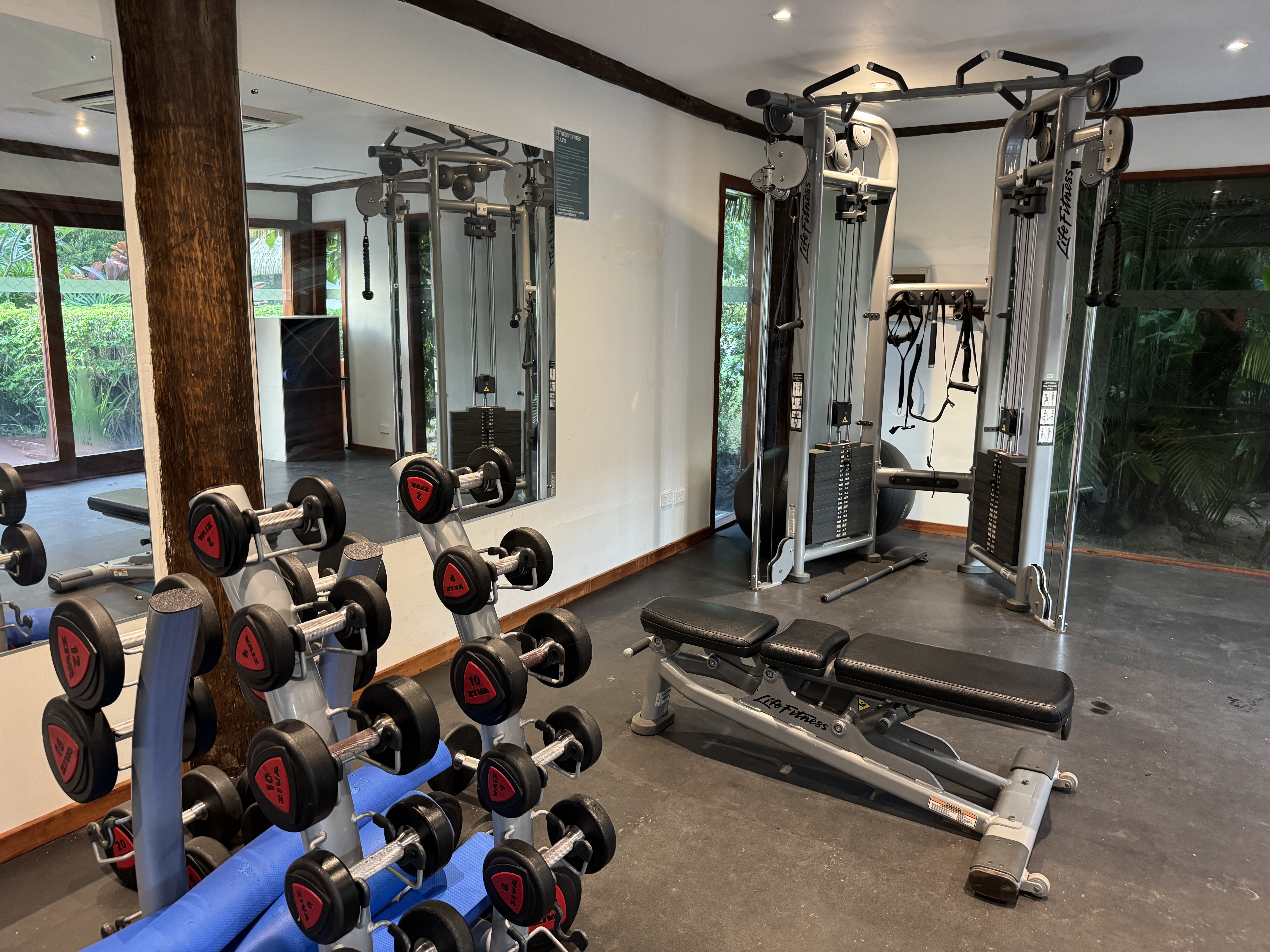 Sheraton Tokoriki Island Gym weight room with dumbbells cable machine bench