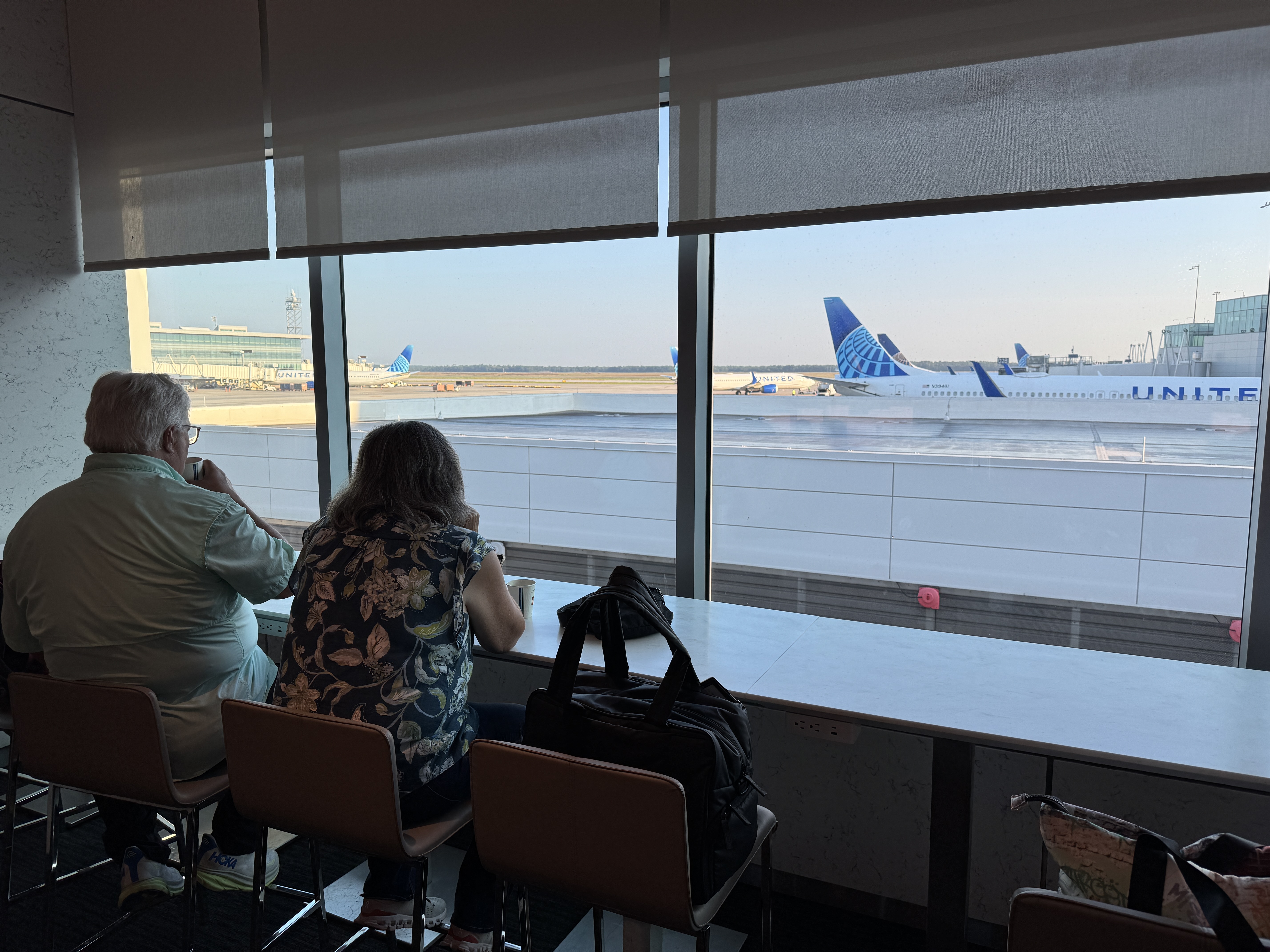 United Club IAH TC couple at window