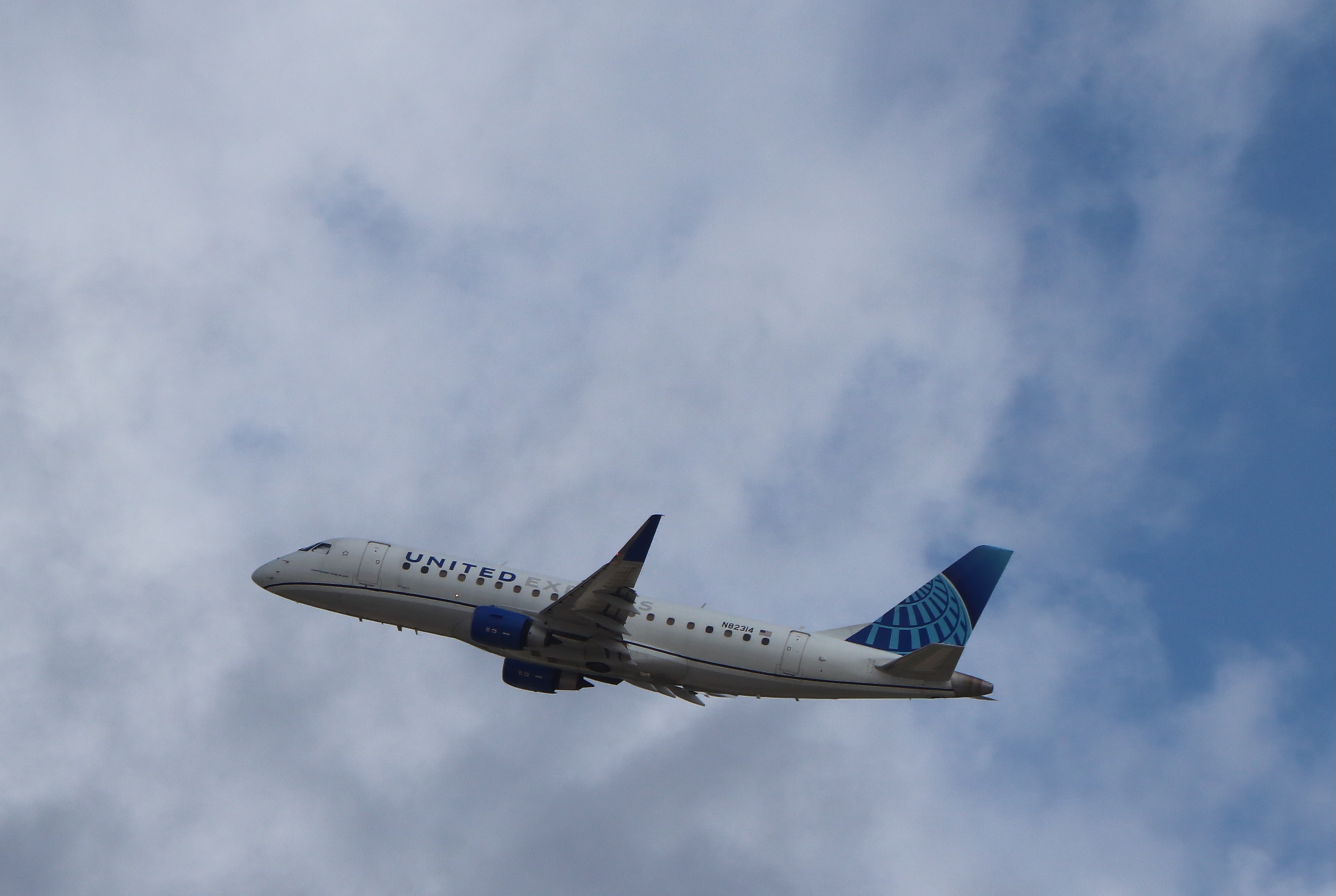 United Express E175 takeoff clouds ATL United Express E175 takeoff clouds ATL