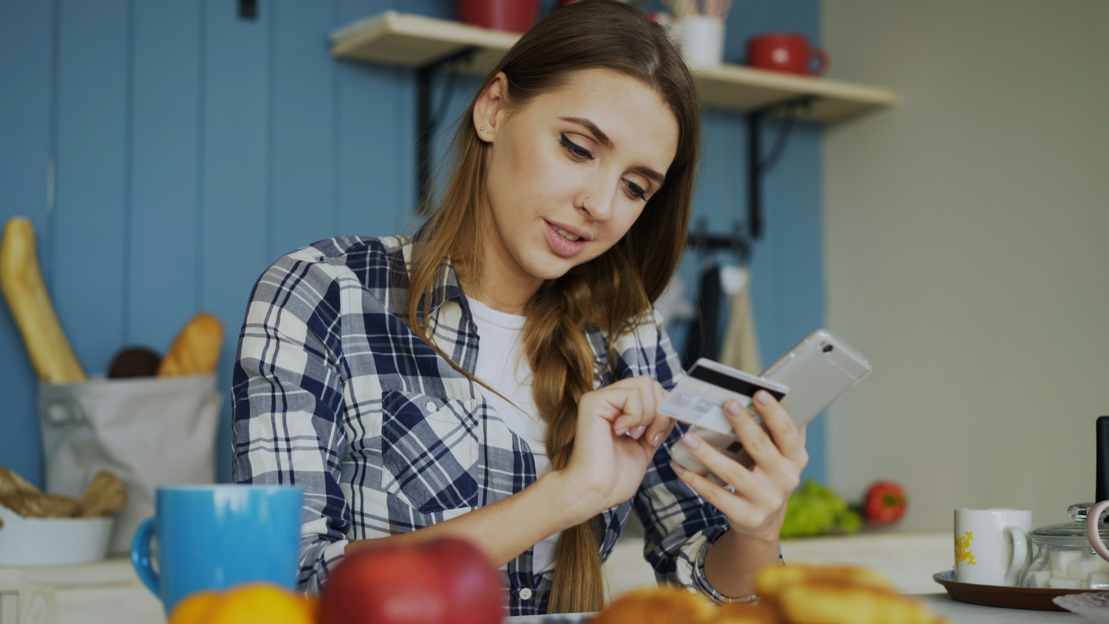 Woman with credit card making phone call Woman with credit card making phone call