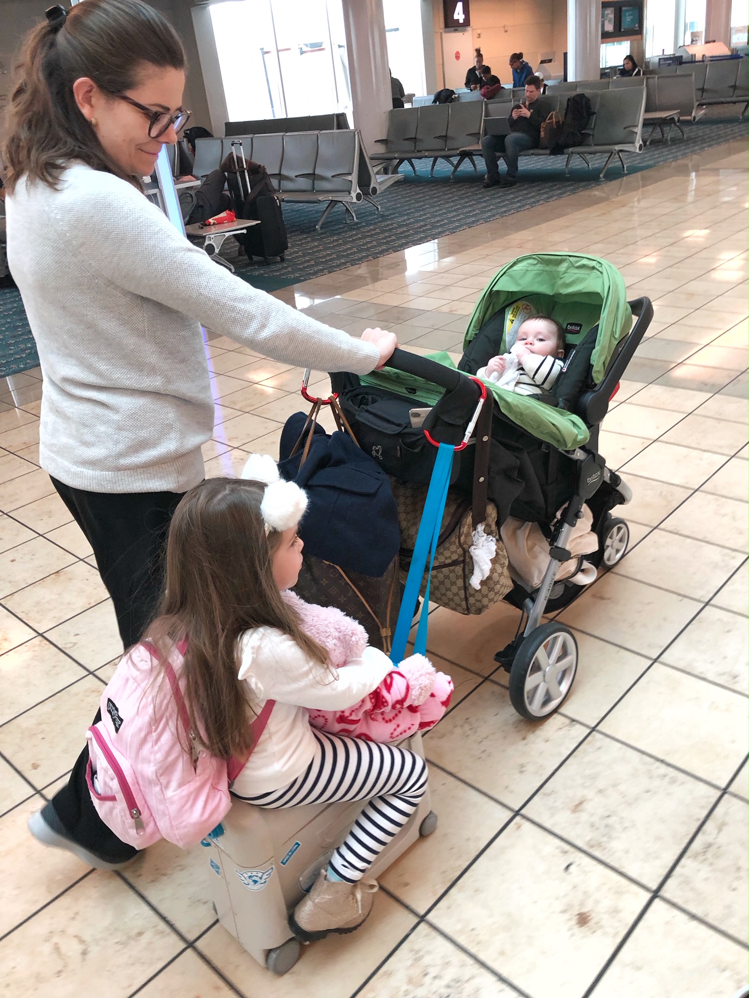 Family With A Britax Stroller and JetKids BedBox In The Airport