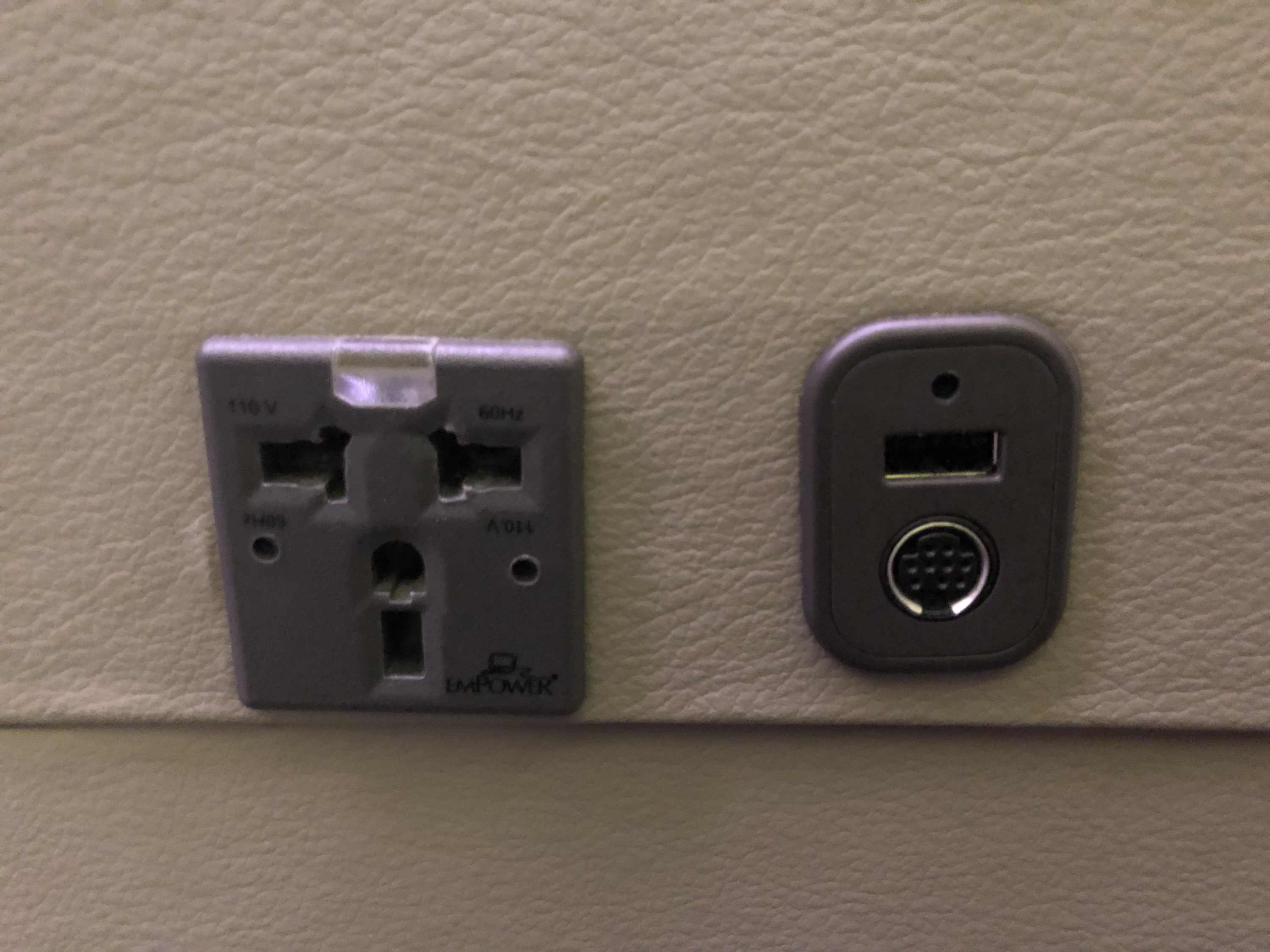 Cathay Pacific 777 first class 110V outlet, USB, and iPod port