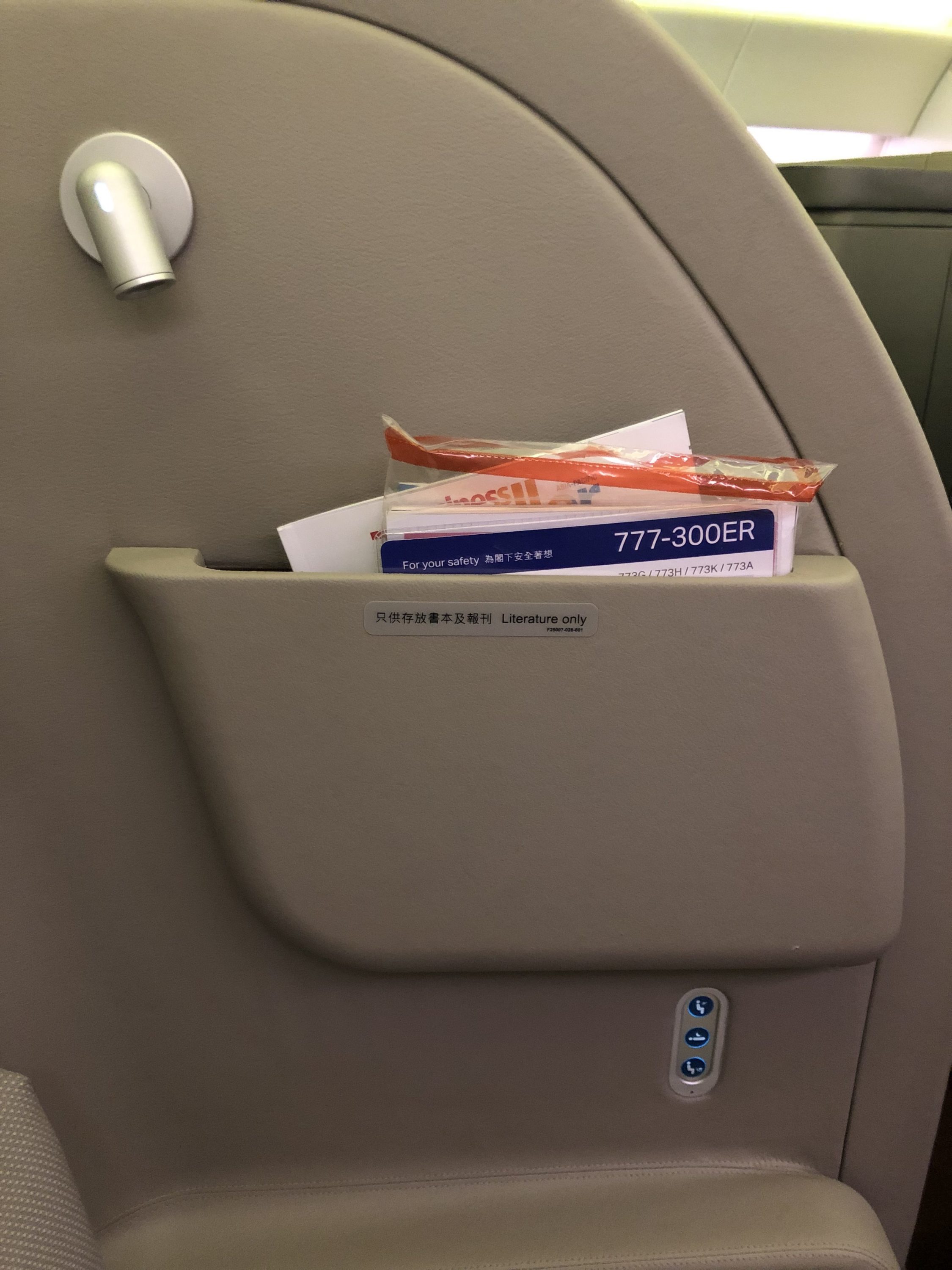 Cathay Pacific 777 first class literature stowage