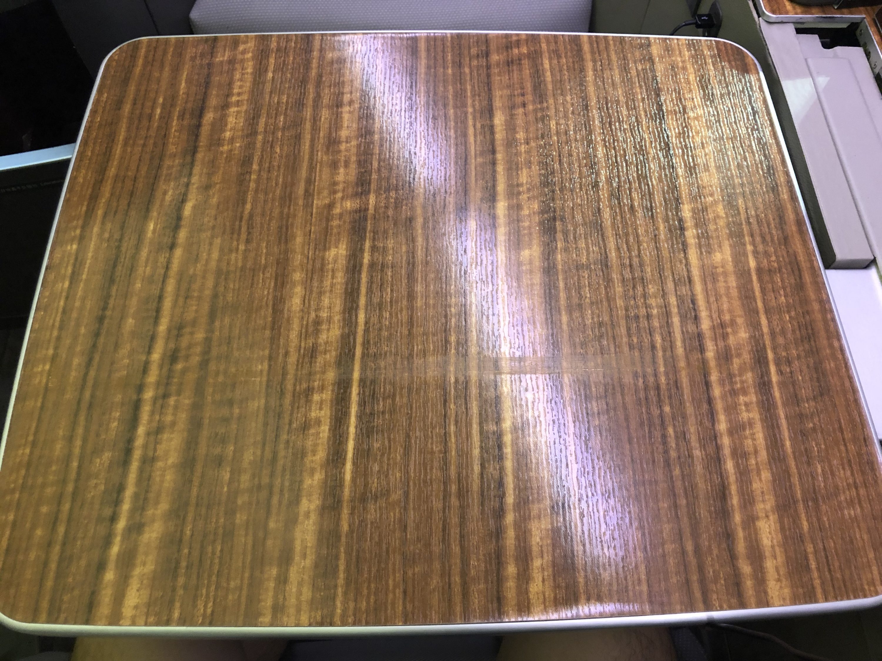 Cathay Pacific 777 first class tray table flat