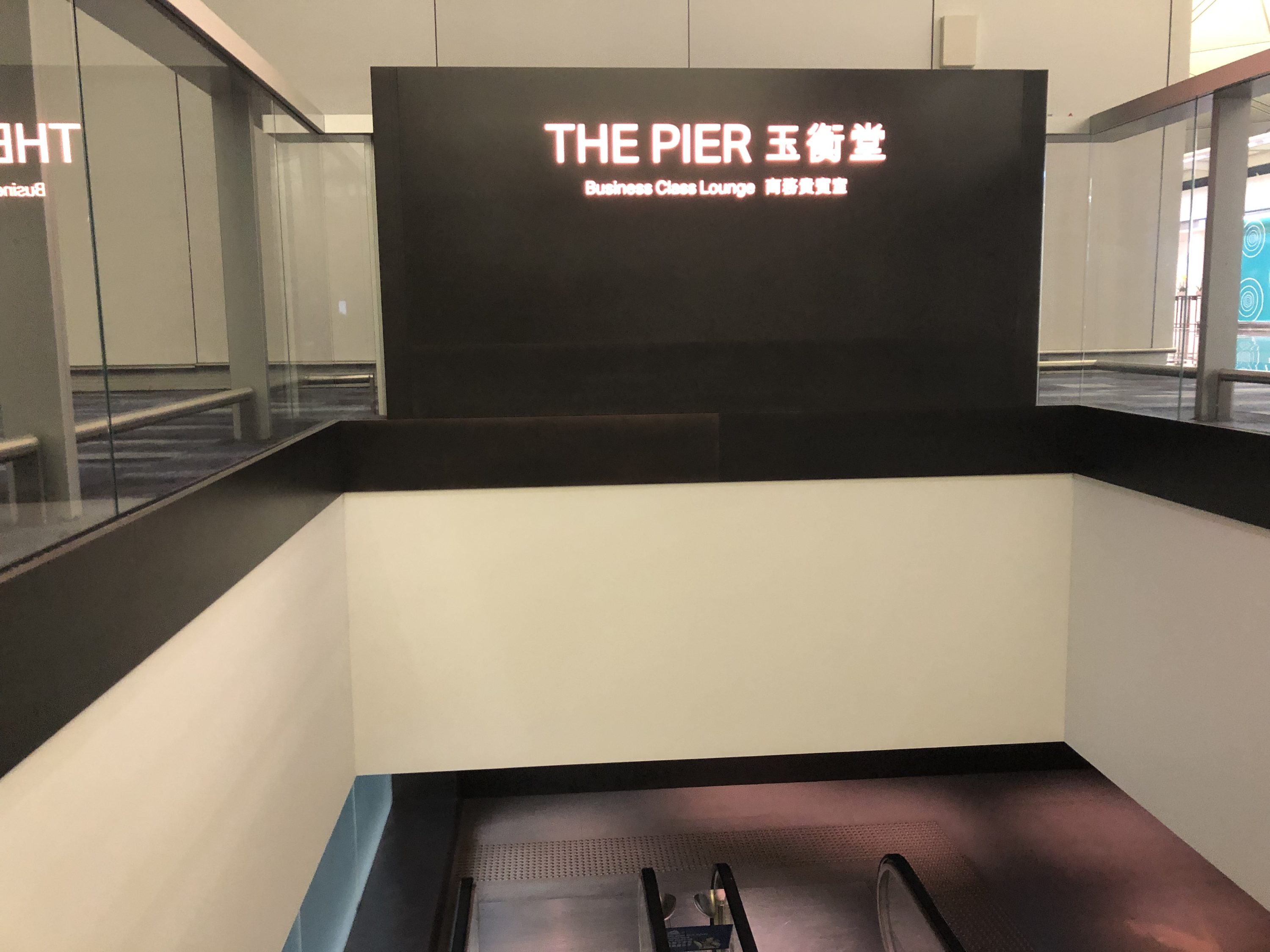 The Pier, Business at Hong Kong International Airport escalator signage