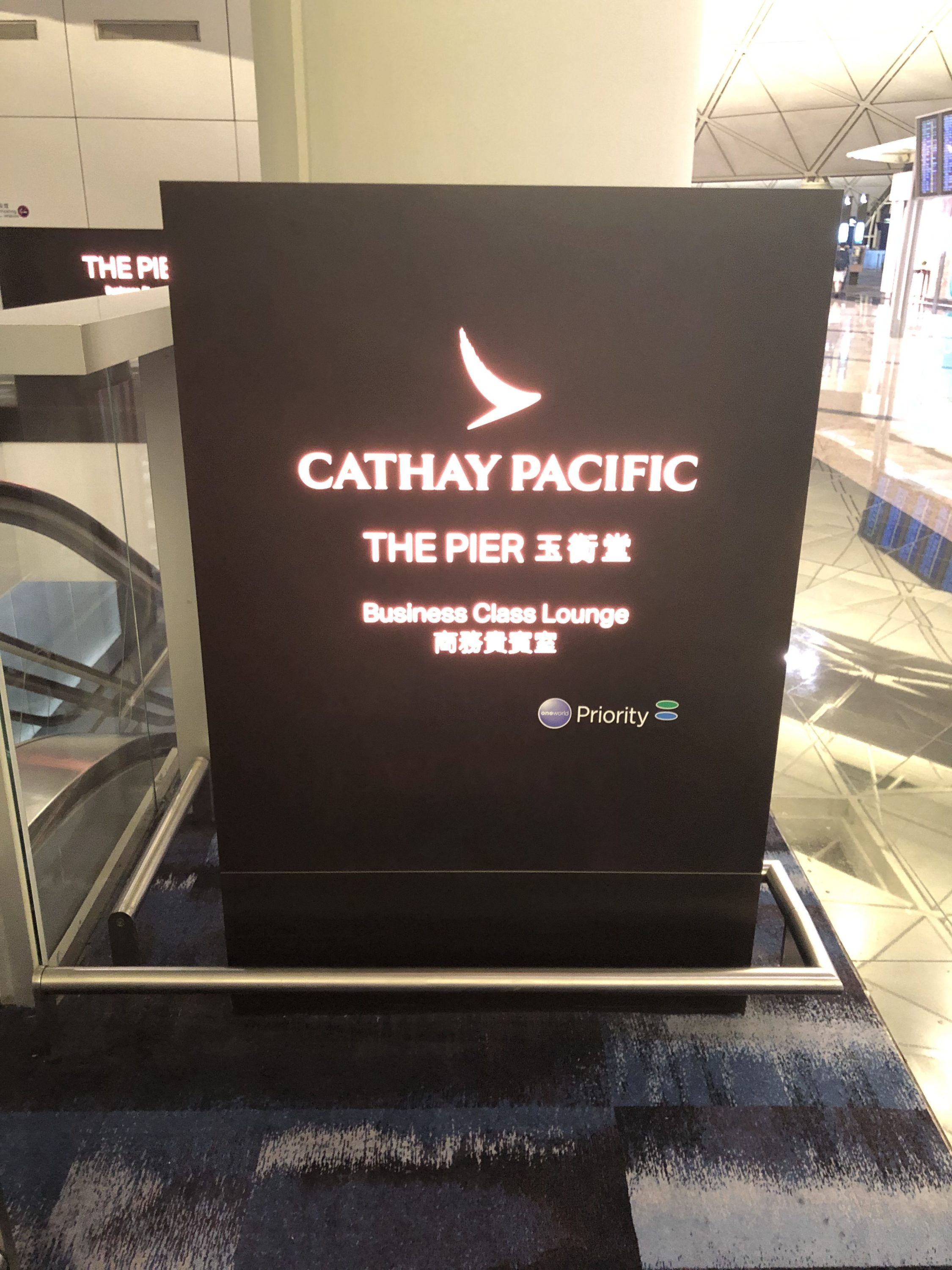 The Pier, Business at Hong Kong International Airport signage