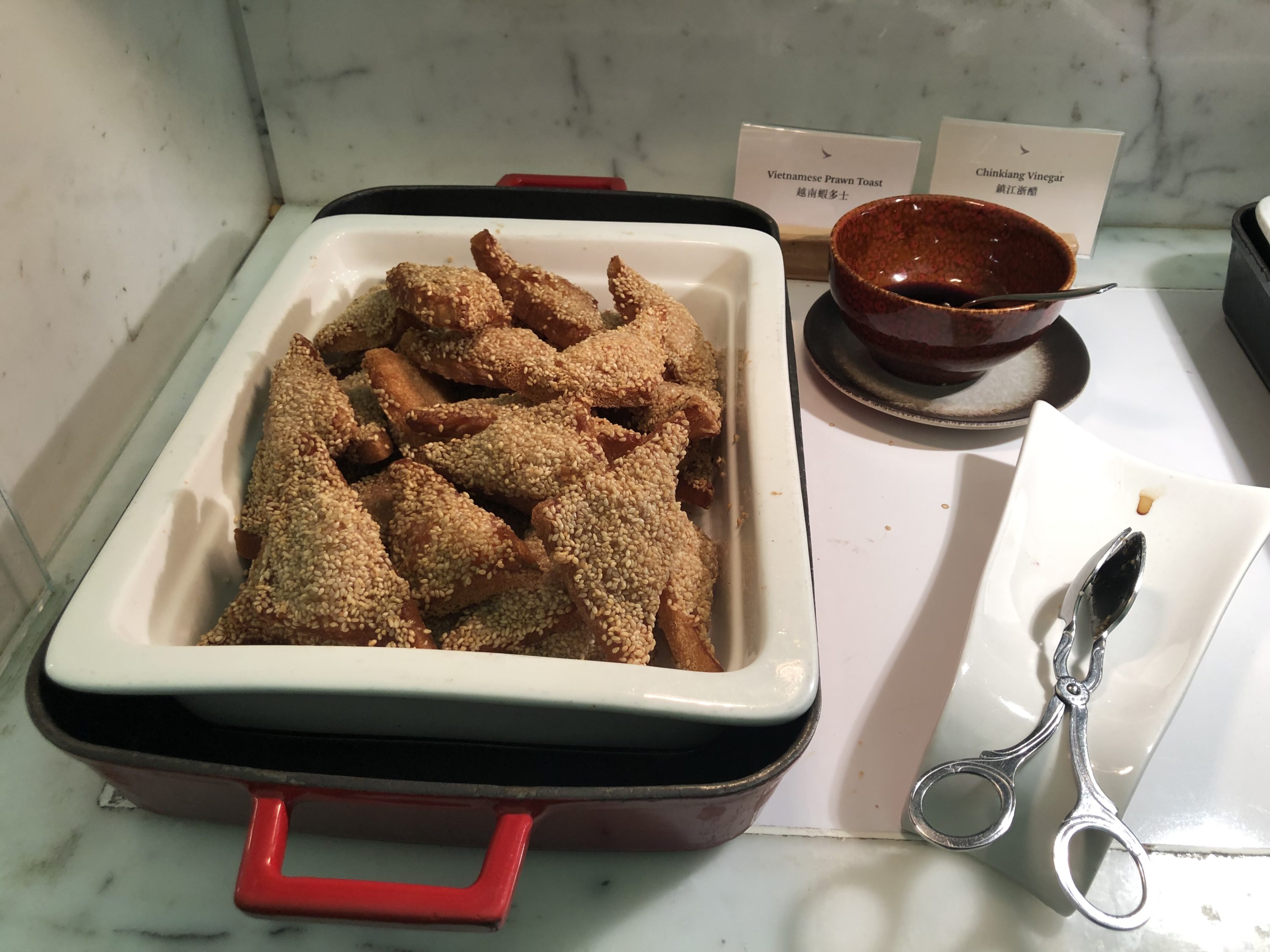 The Wing, Business at Hong Kong International Airport long bar prawn toast