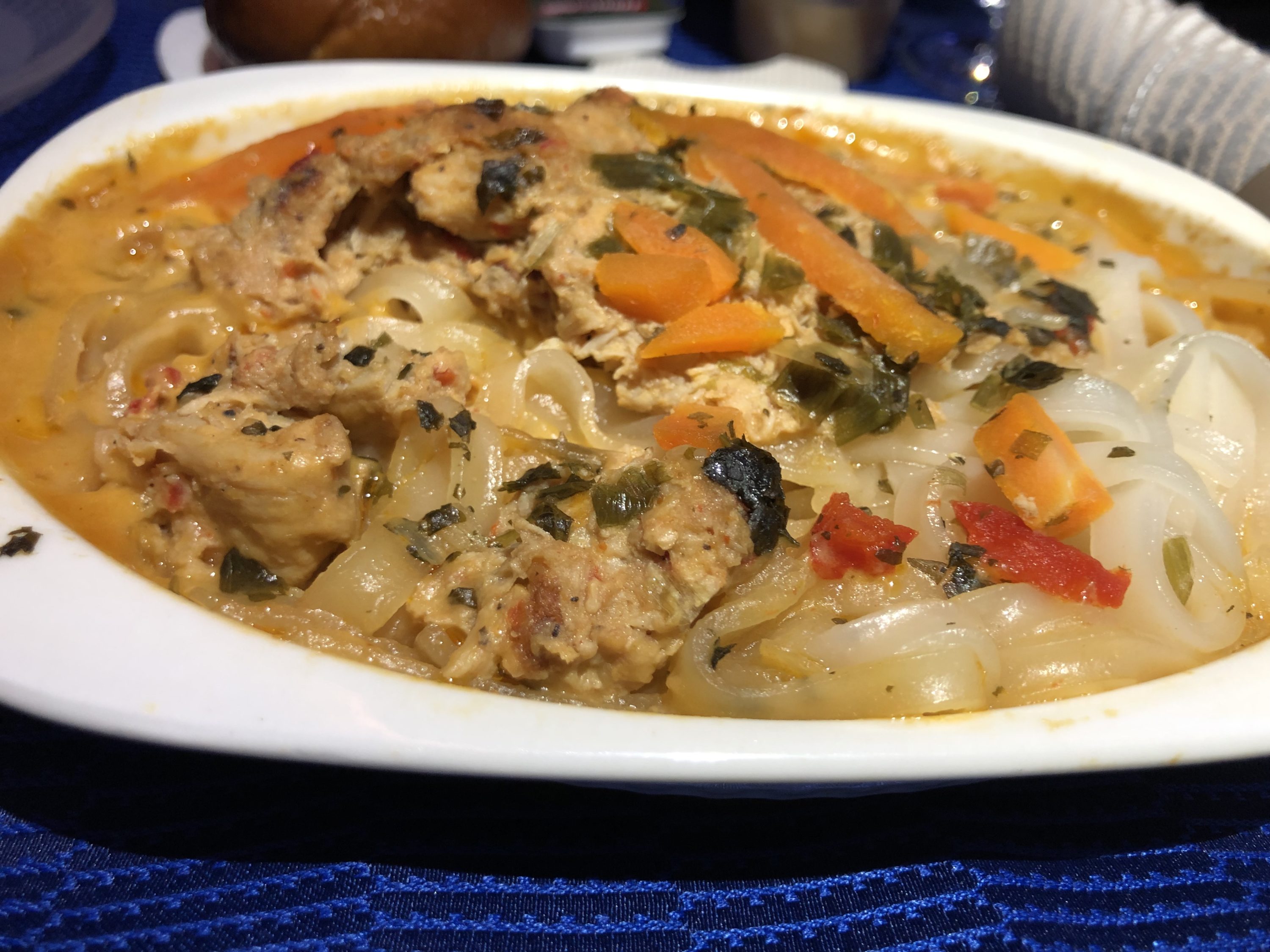 United Polaris 787-10 thai chicken with rice noodles