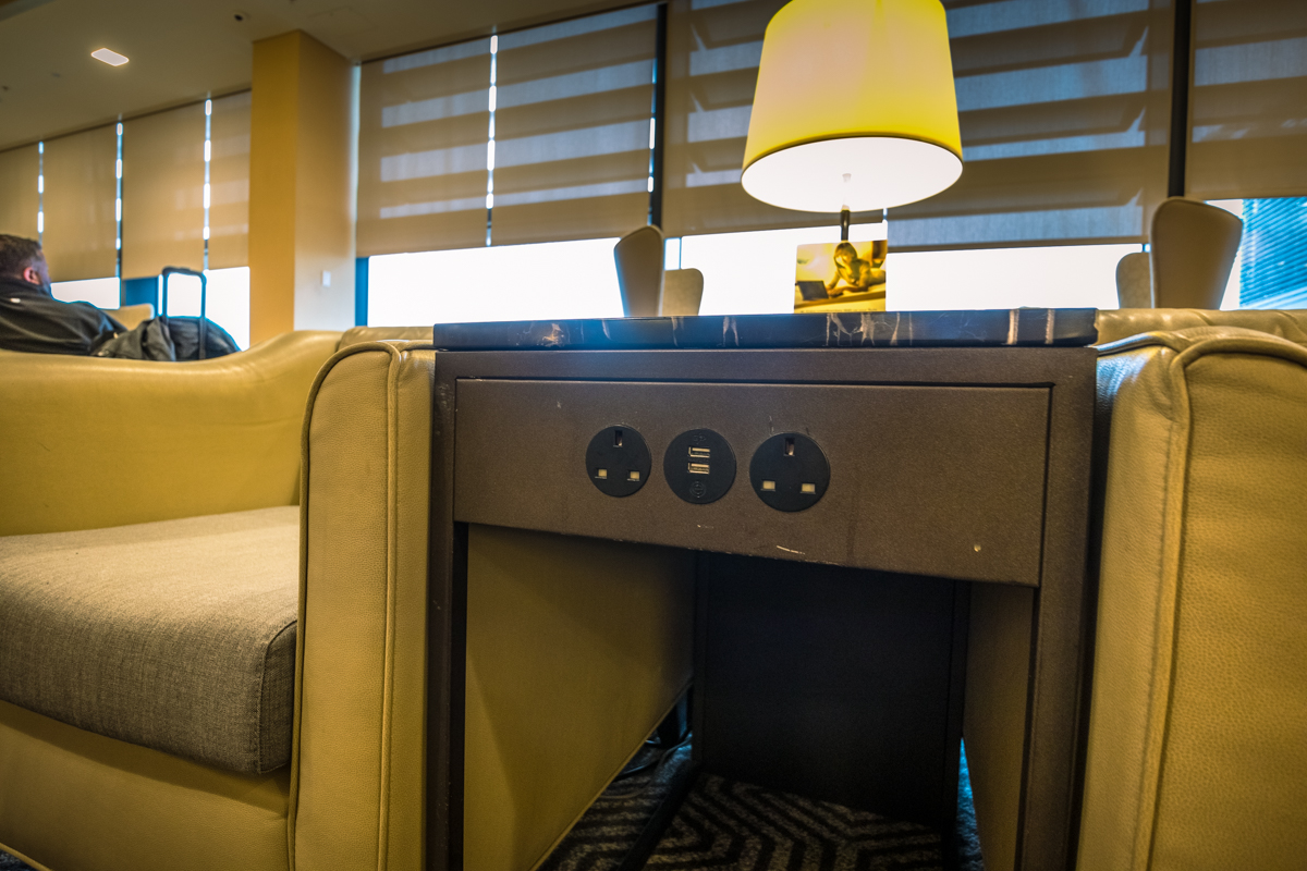 Singapore Airlines Heathrow Lounge --- Power Between Armchairs