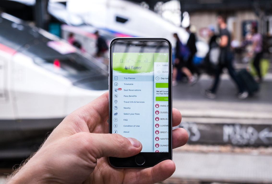 Rail Planner App in front of French TGV train