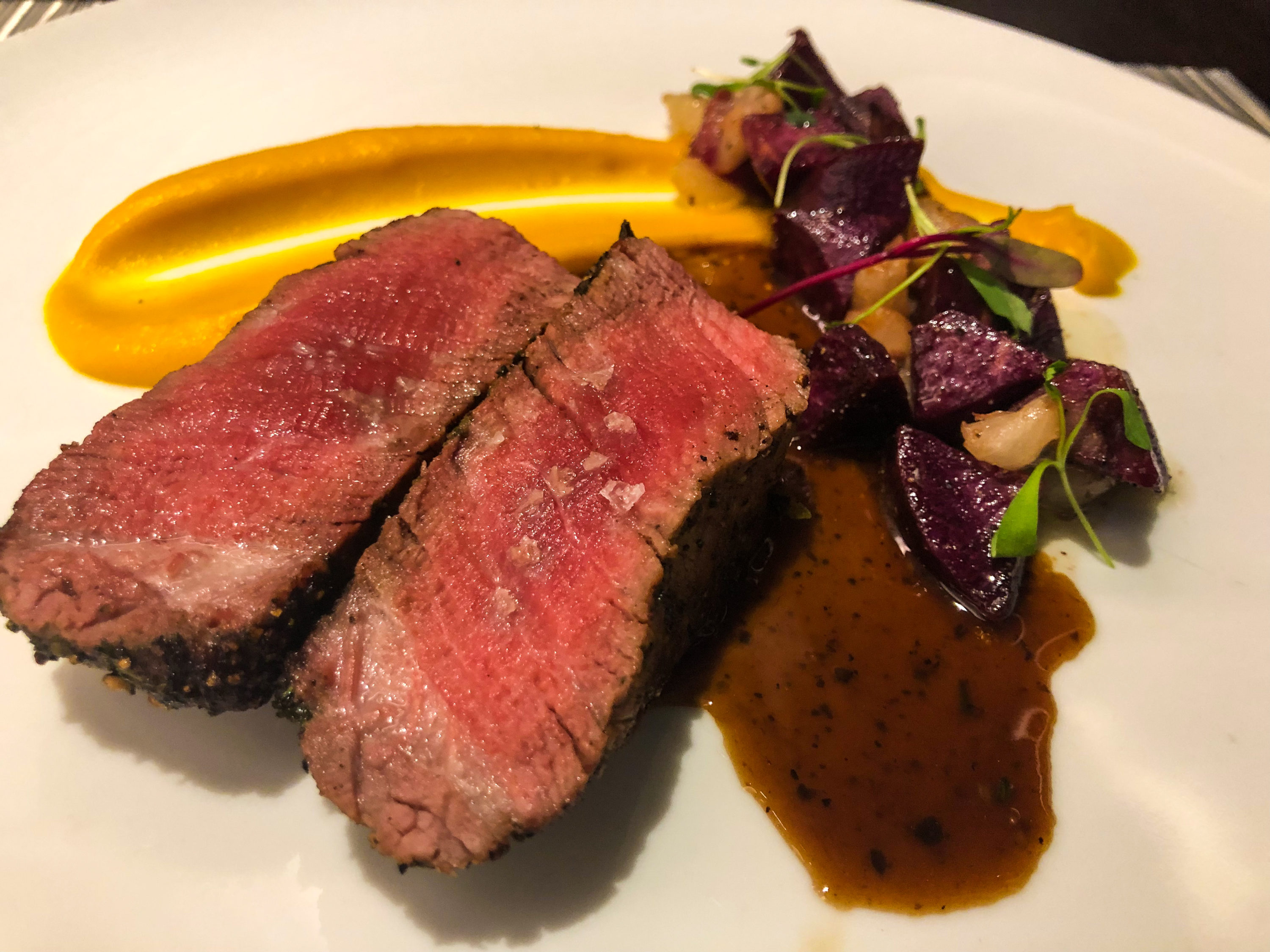 American Airlines Flagship First Dining LAX cracked peppercorn petite filet close-up
