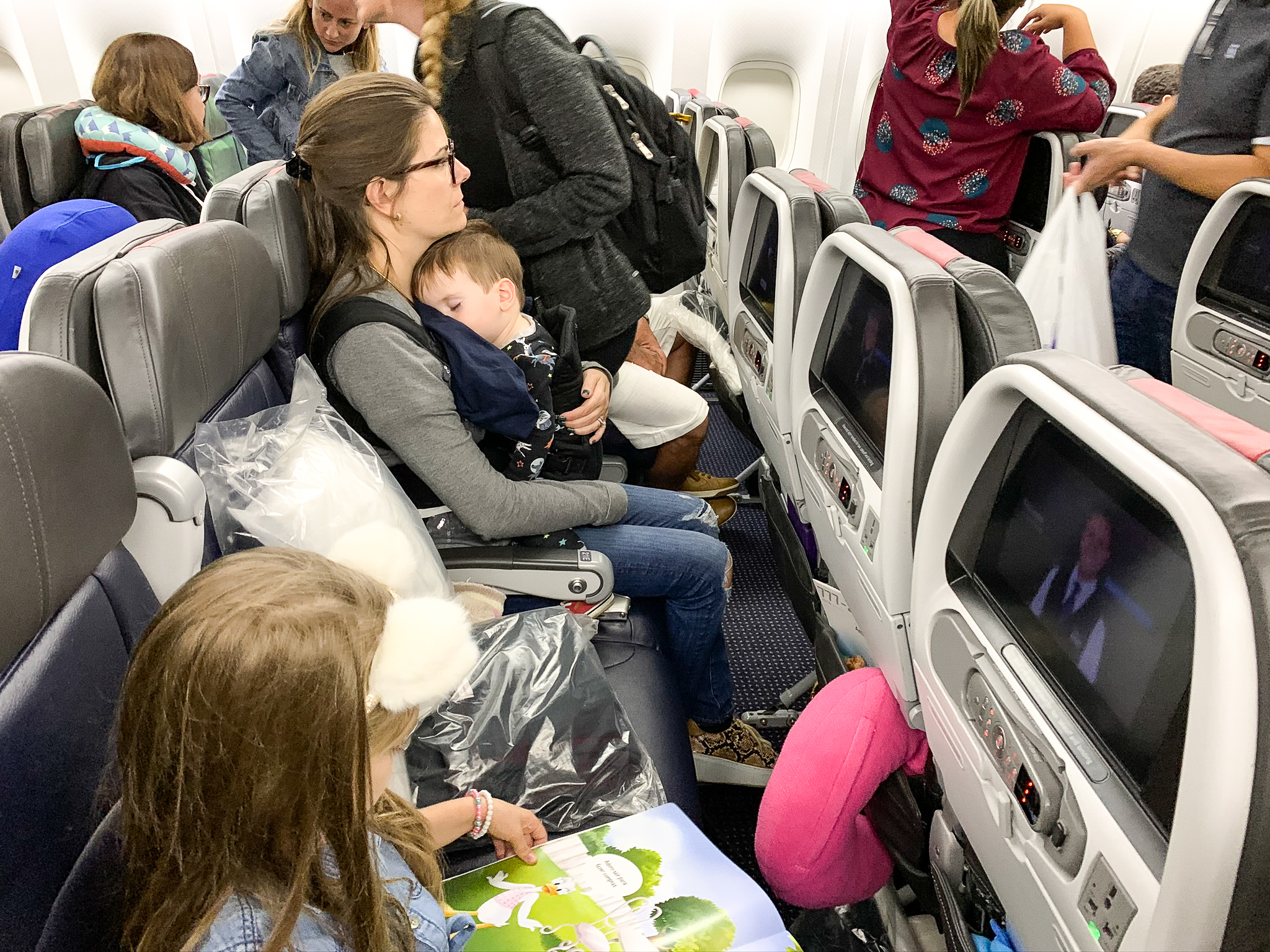 Family in AA coach Family flying American Airlines economy