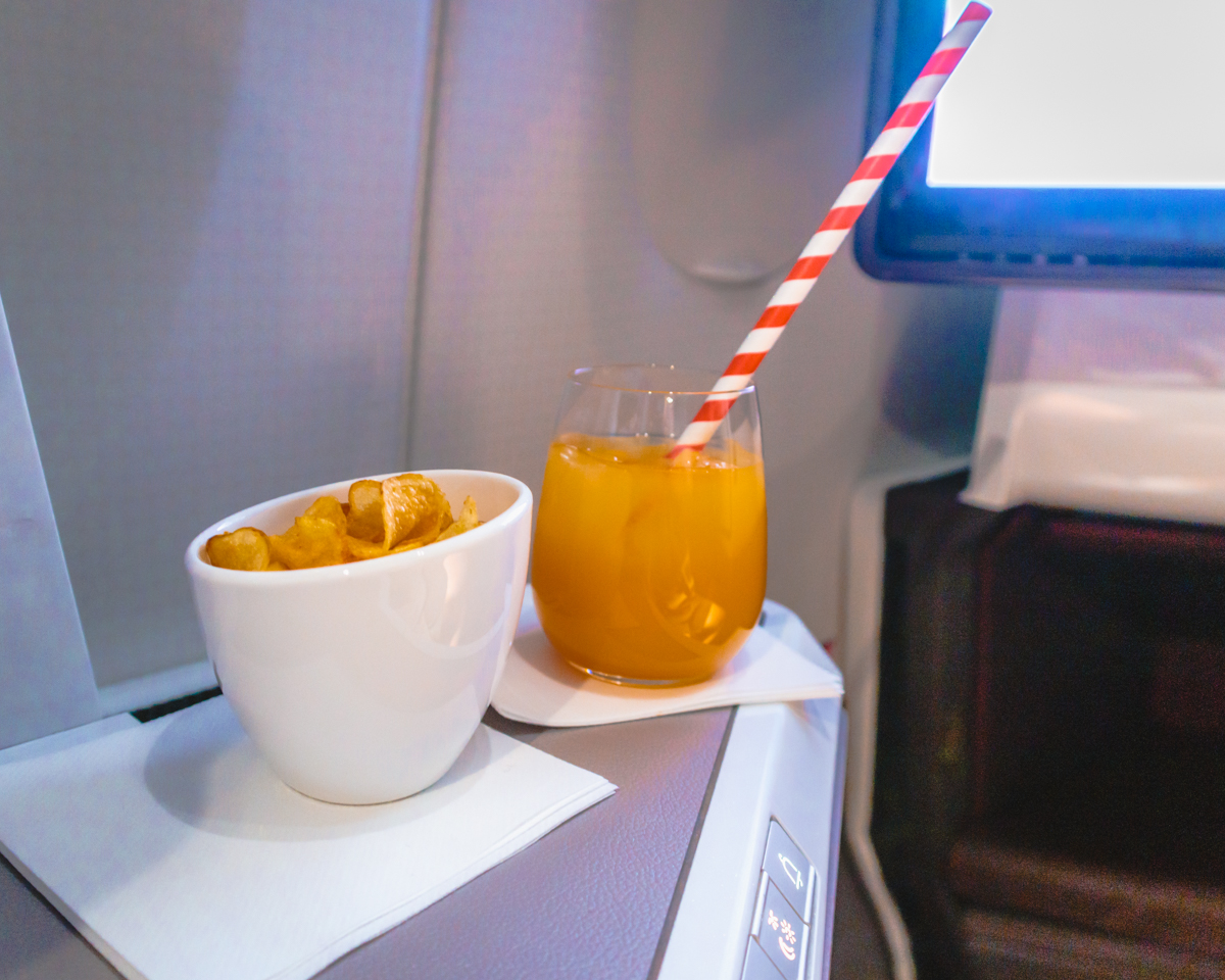 Virgin Atlantic Airbus A350 Upper Class Post-Take-Off Beverage a Virgin Atlantic Airbus A350 Upper Class Post-Take-Off Beverage and Crisps