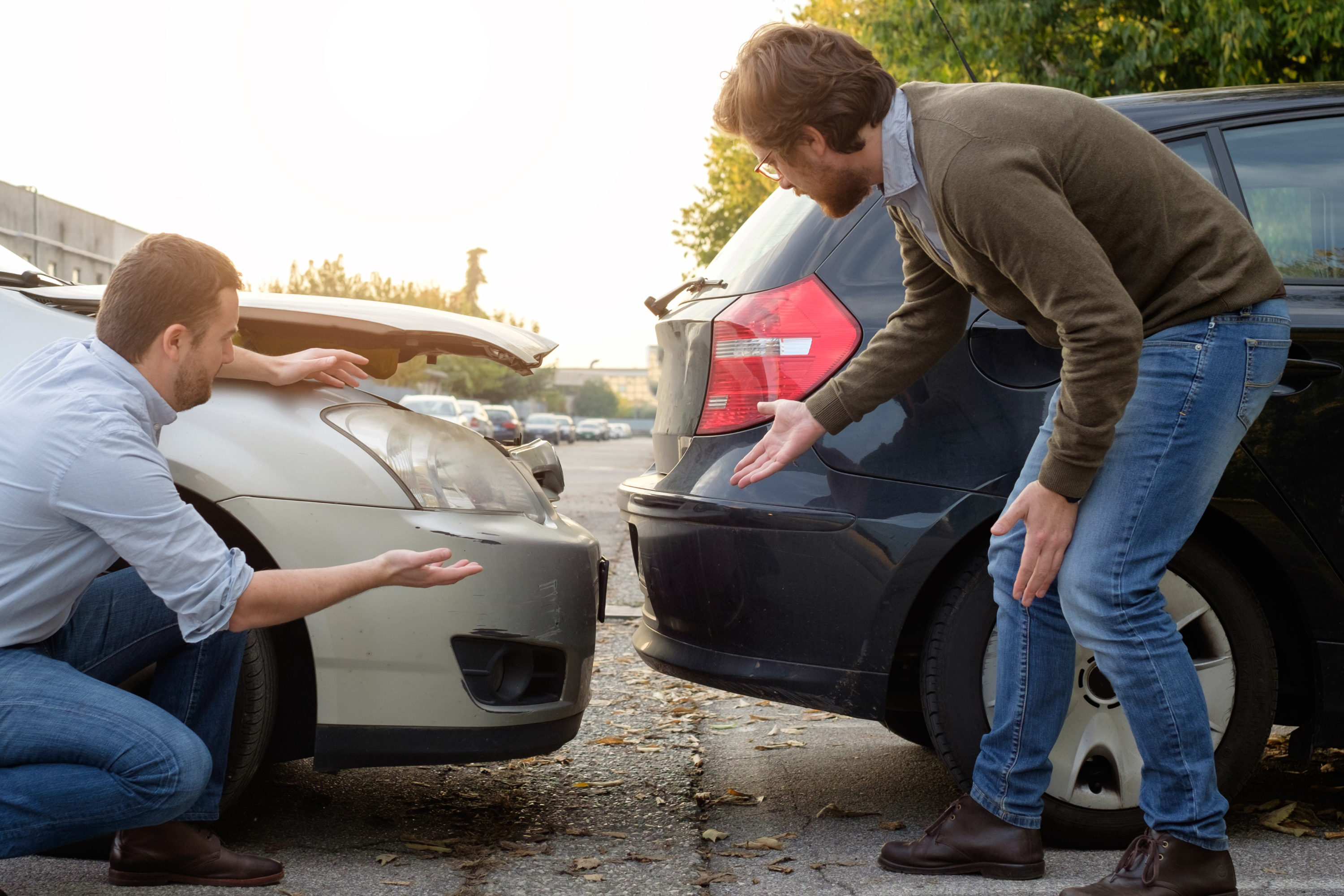 Two Men Talking After Minor Car Accident Two Men Talking After Minor Car Accident