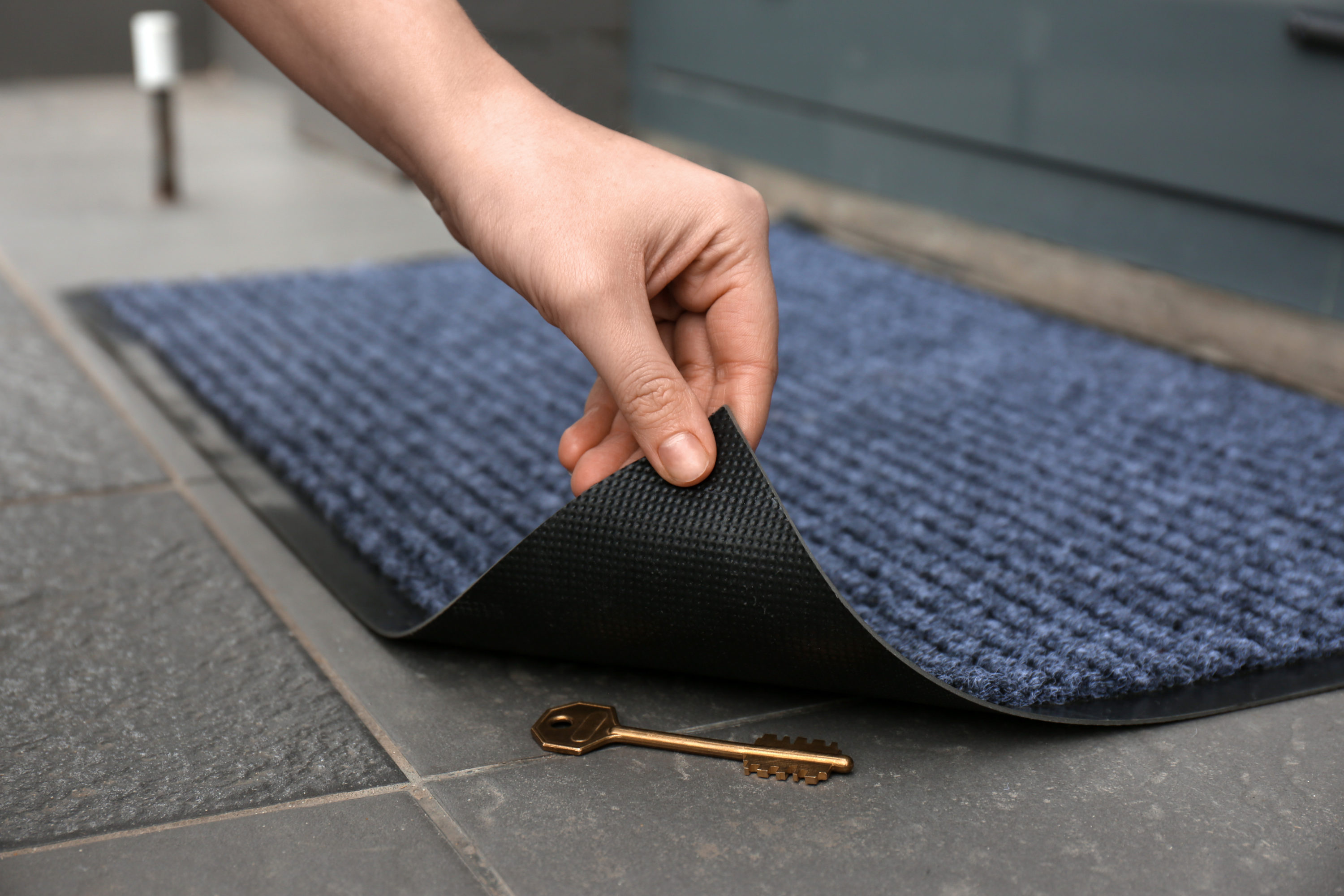 Key hidden under doormat