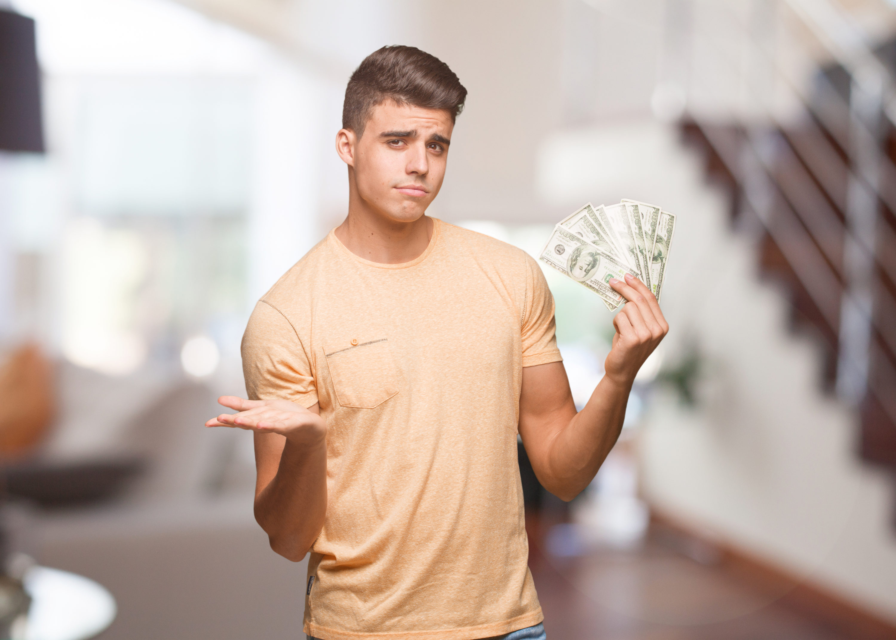 Points versus cash man holding cash