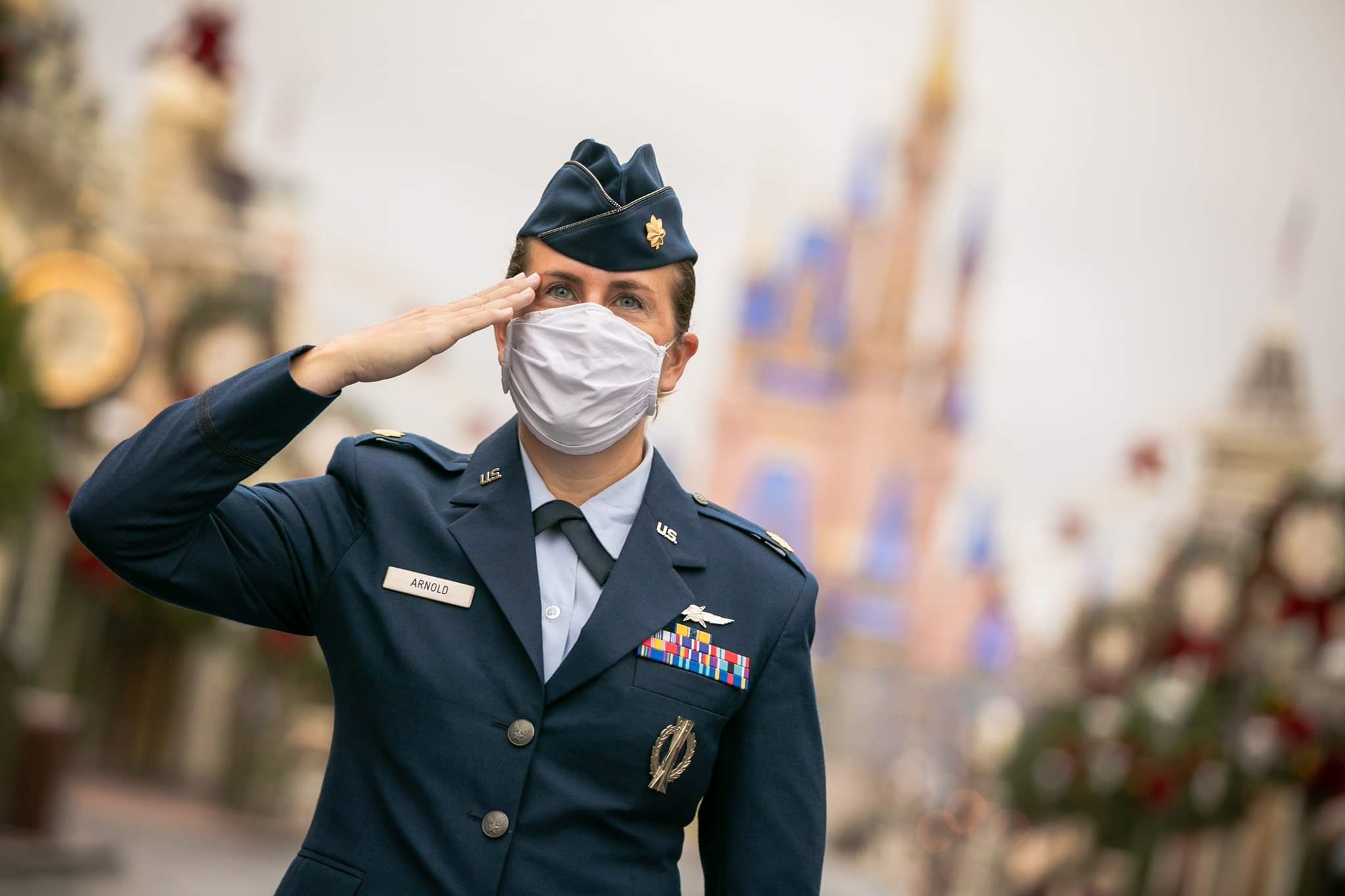 Service member salutes at Walt Disney World