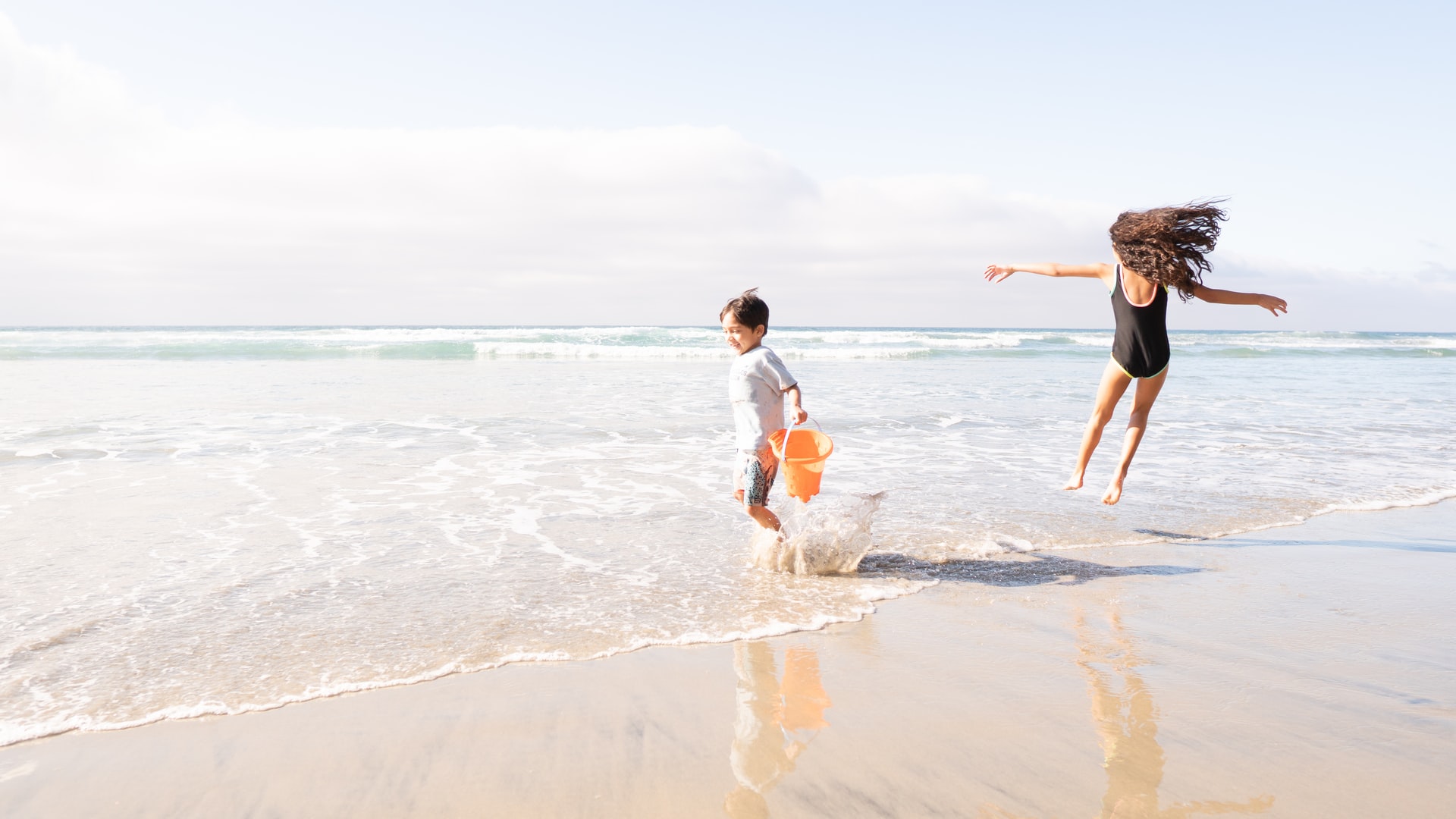 Kids on the beach in San Diego Image Credit Garrett Patz via Unsplash