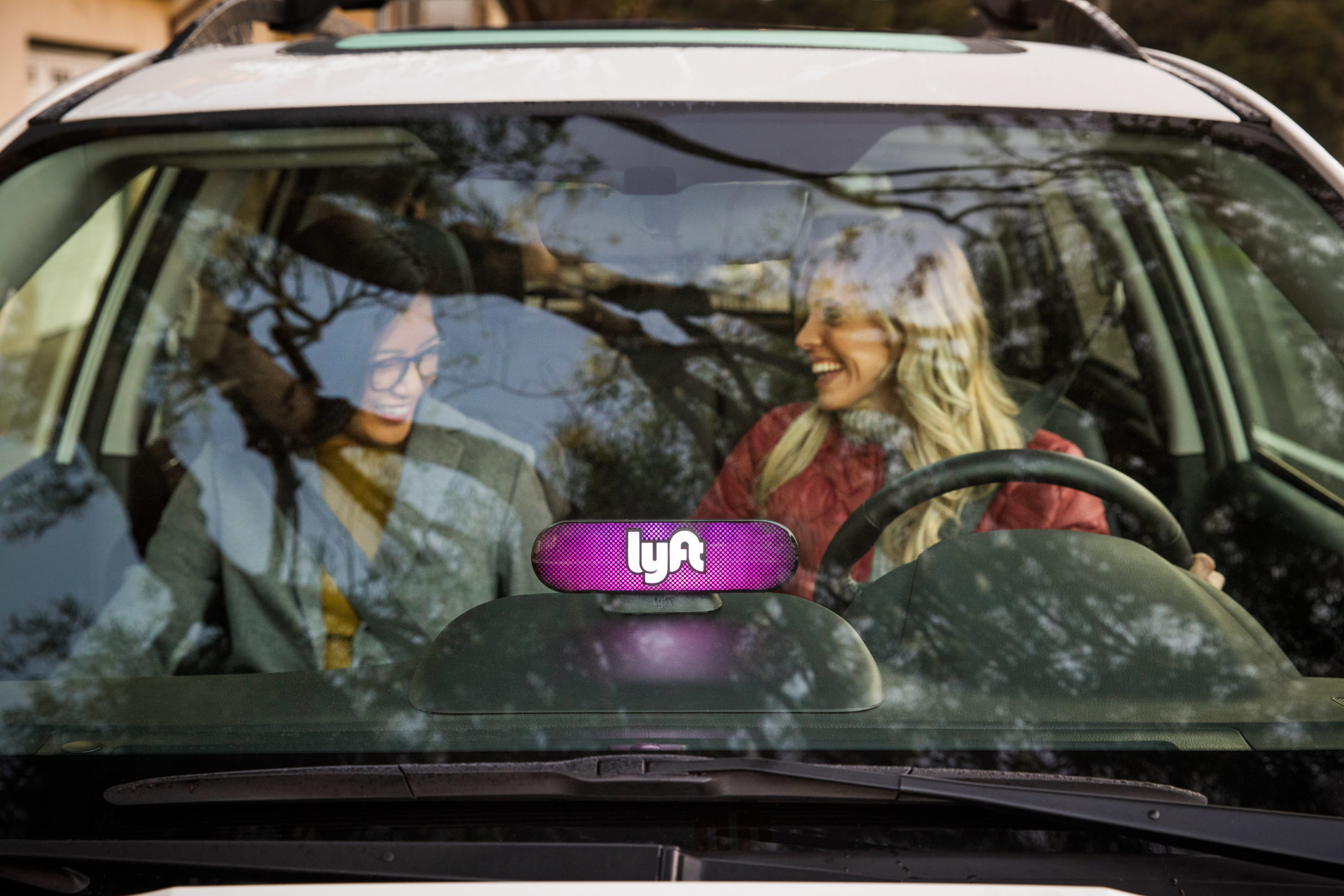 Lyft driver and passenger Lyft driver and passenger