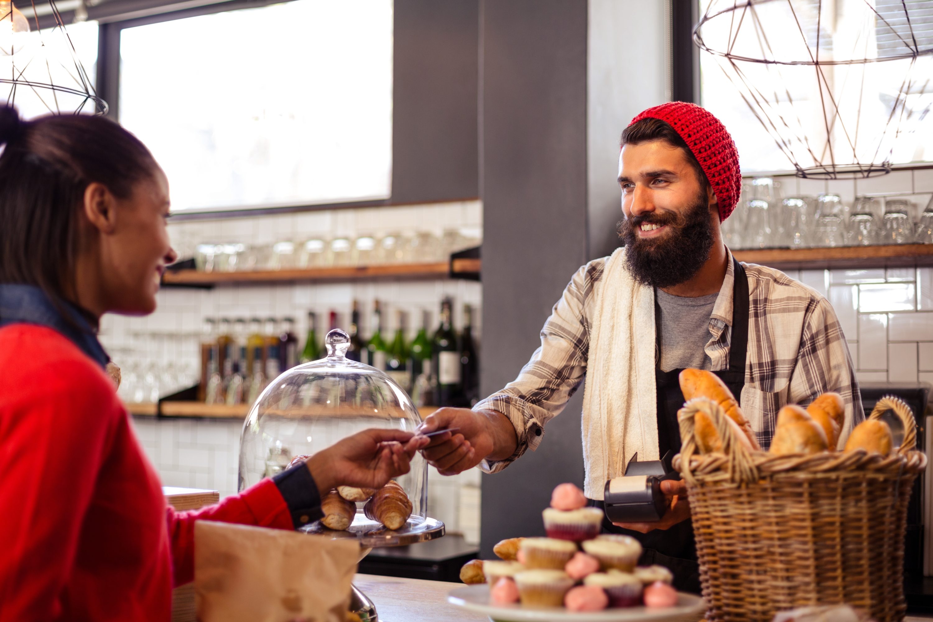 Woman paying at restaurant cafe dining out