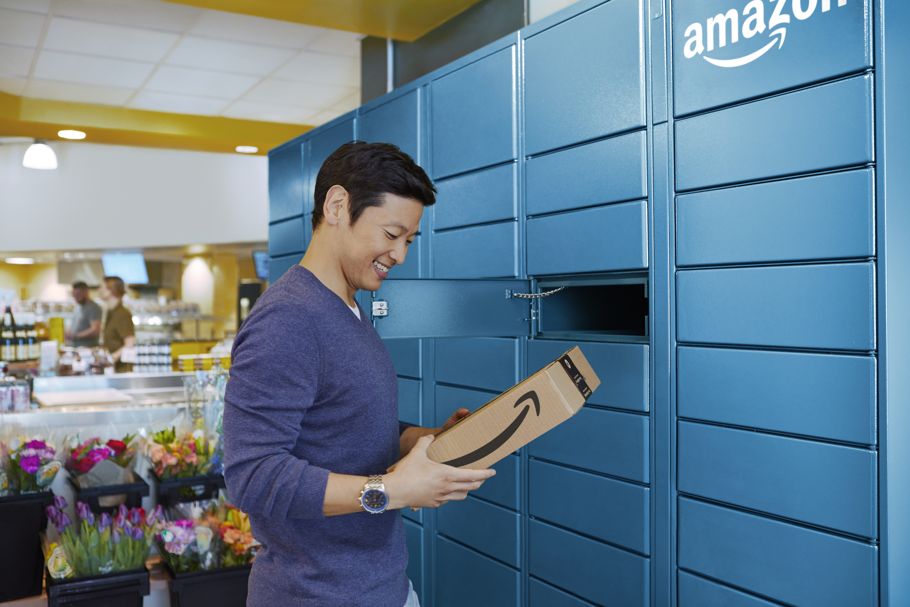Man getting Amazon package at locker