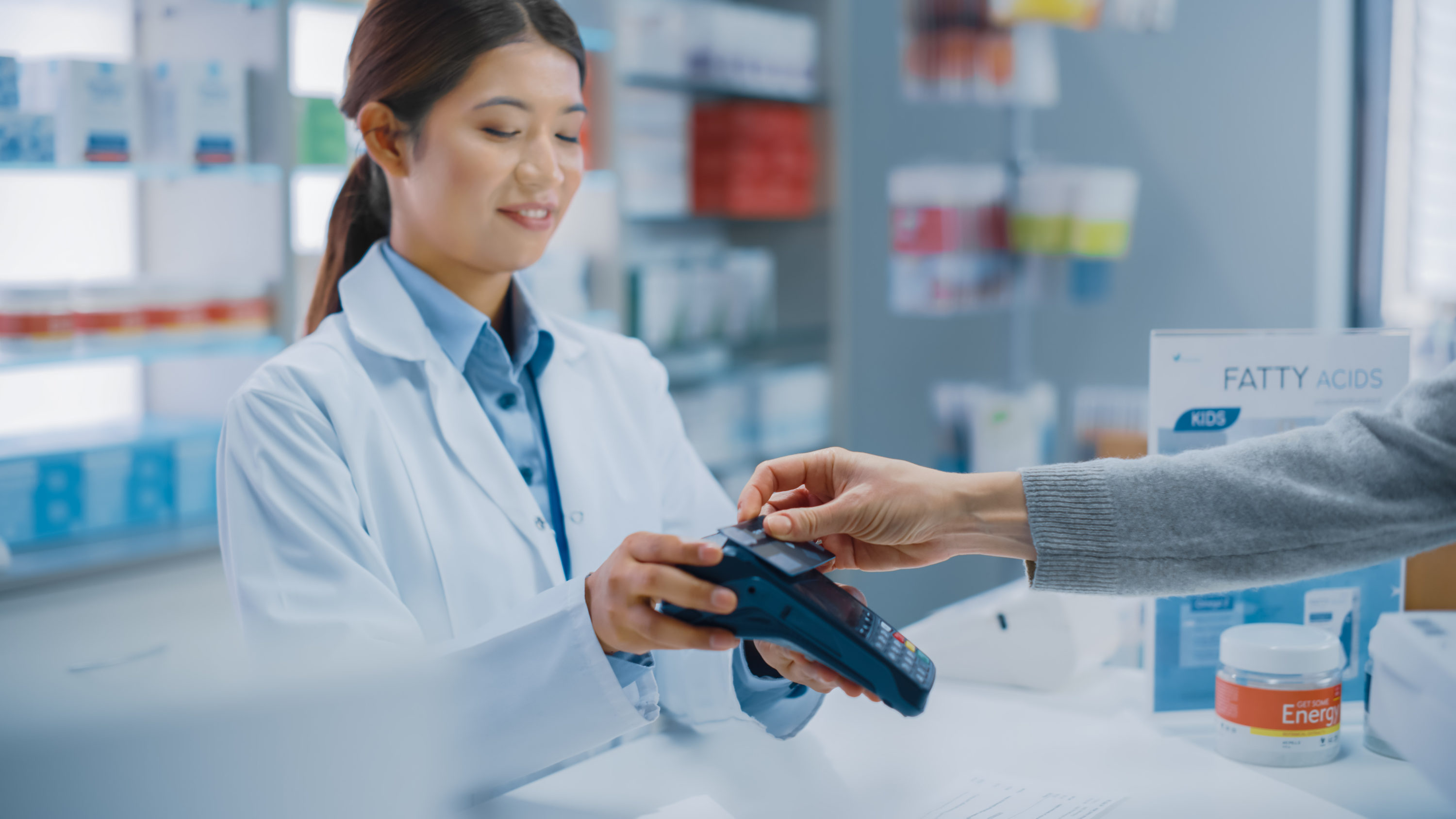 Customer Checking Out at Pharmacy Customer Checking Out at Pharmacy