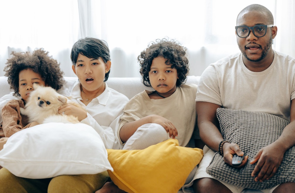 Family watching TV Family watching TV