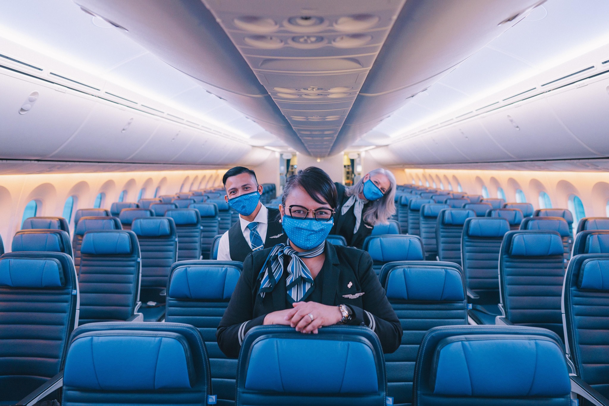 United economy masked flight attendants