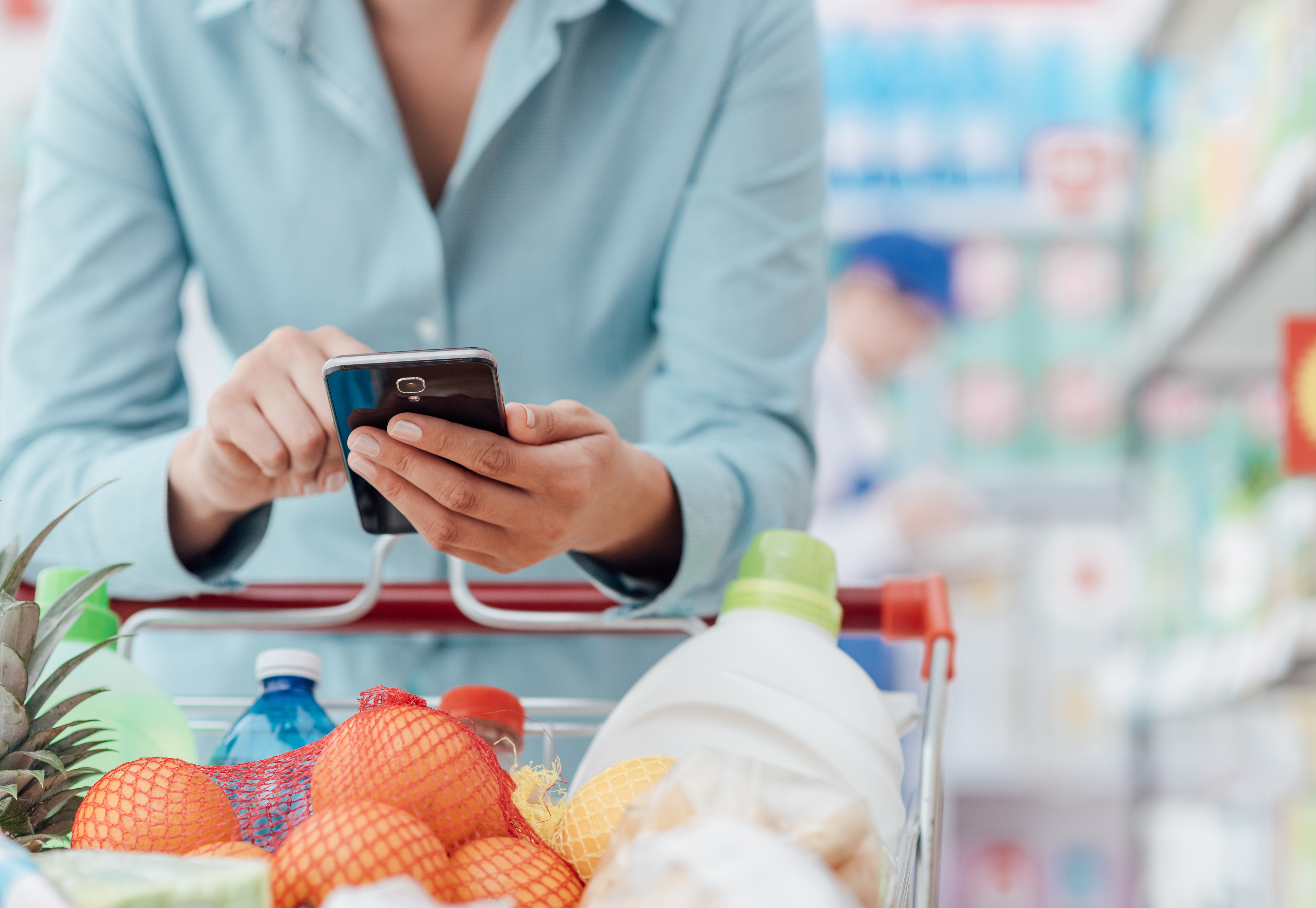 Woman on phone in grocery store