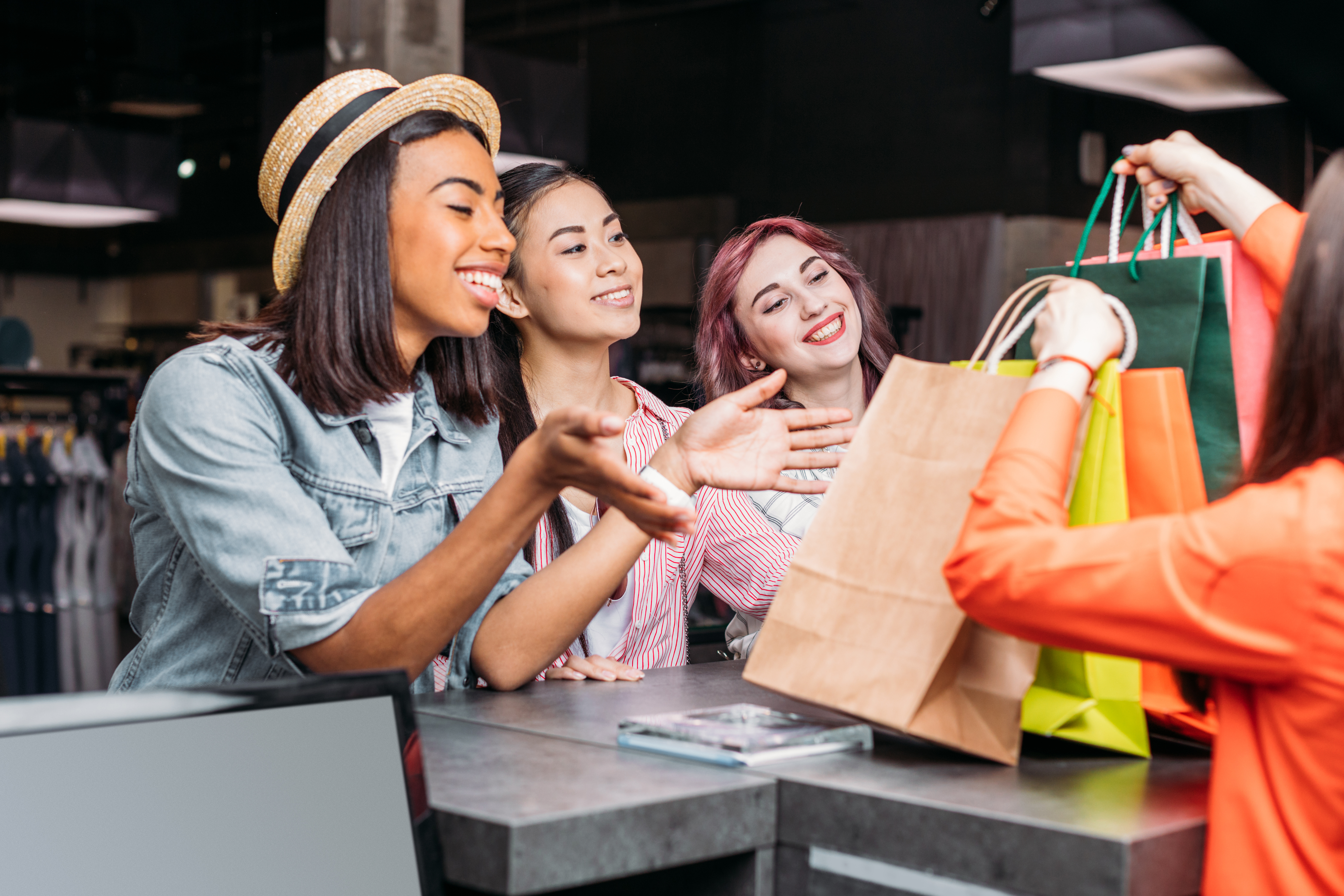 Young women shopping at clothing store