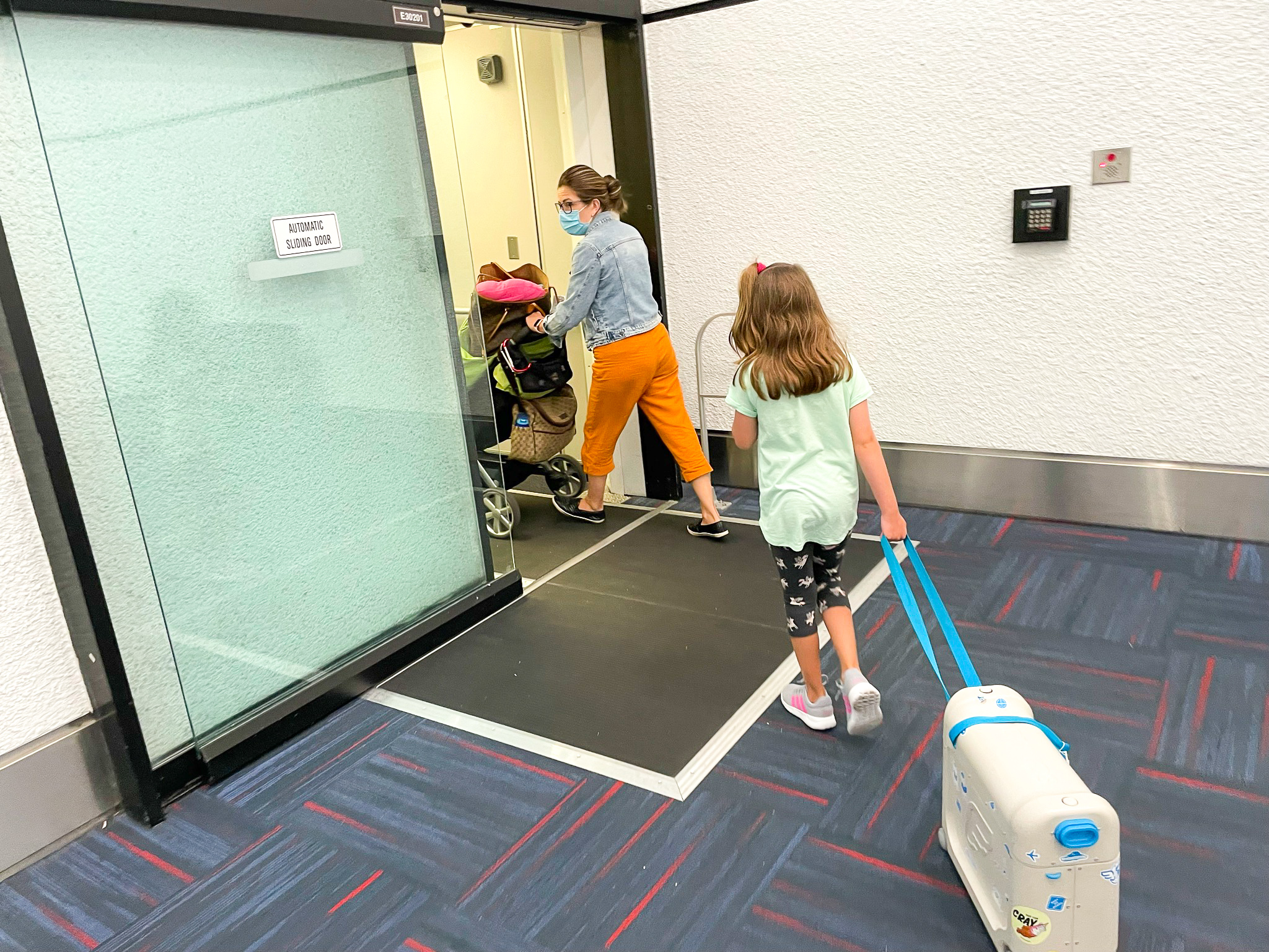 American Airlines First Flagship Business Class Miami to Boston girl pulling bag