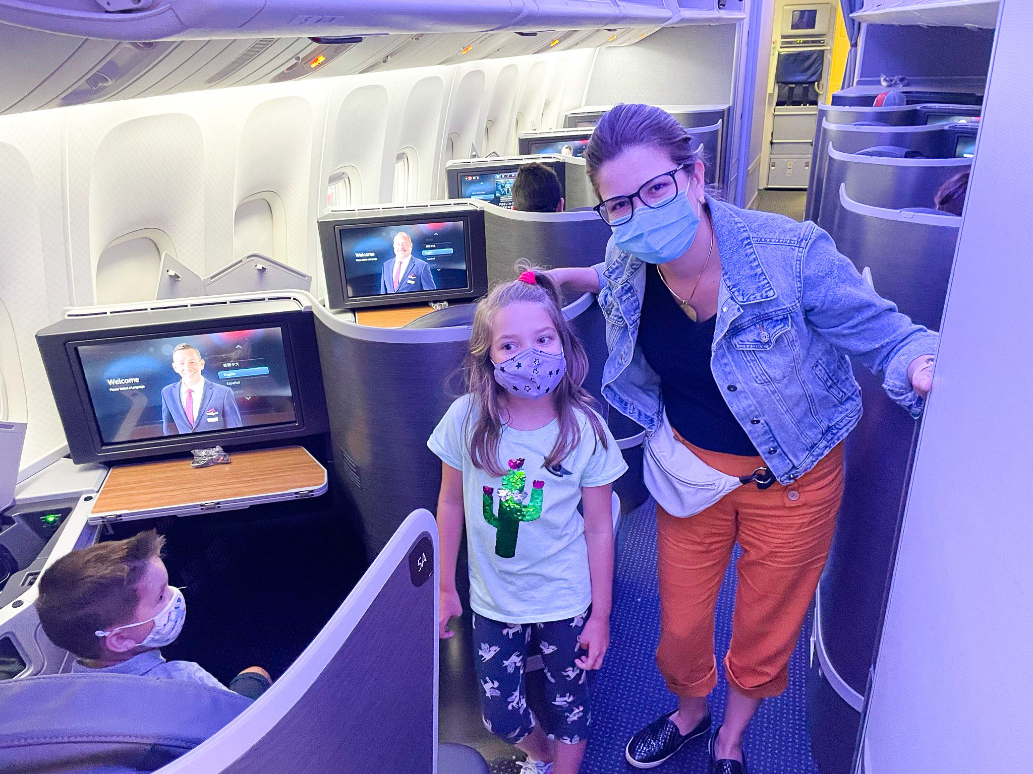 American Airlines First Flagship Business Class Miami to Boston mom and daughter in masks