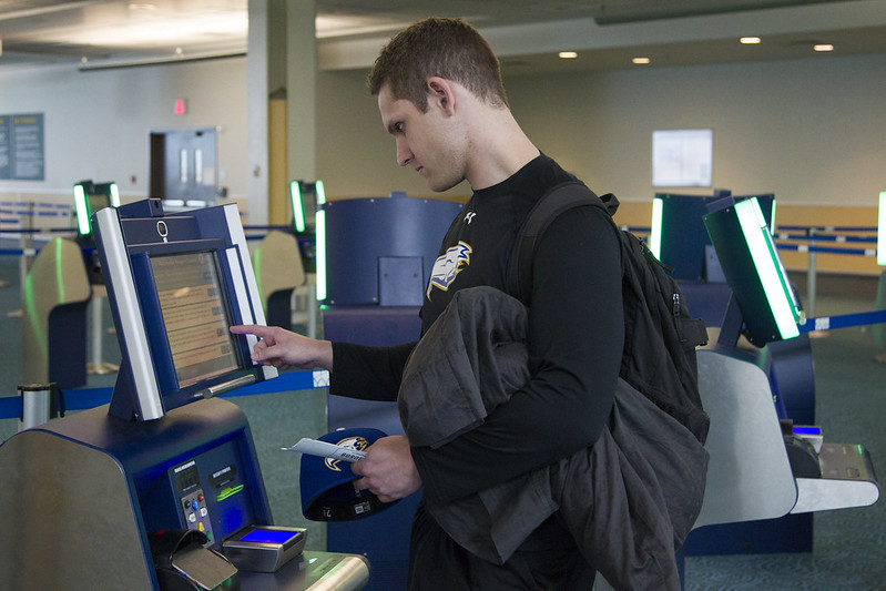 Man using Global Entry kiosk Man using Global Entry kiosk