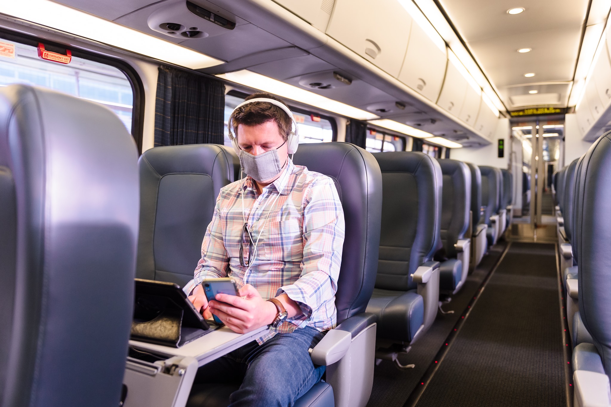 Amtrak Acela passenger on phone Amtrak Acela passenger on phone