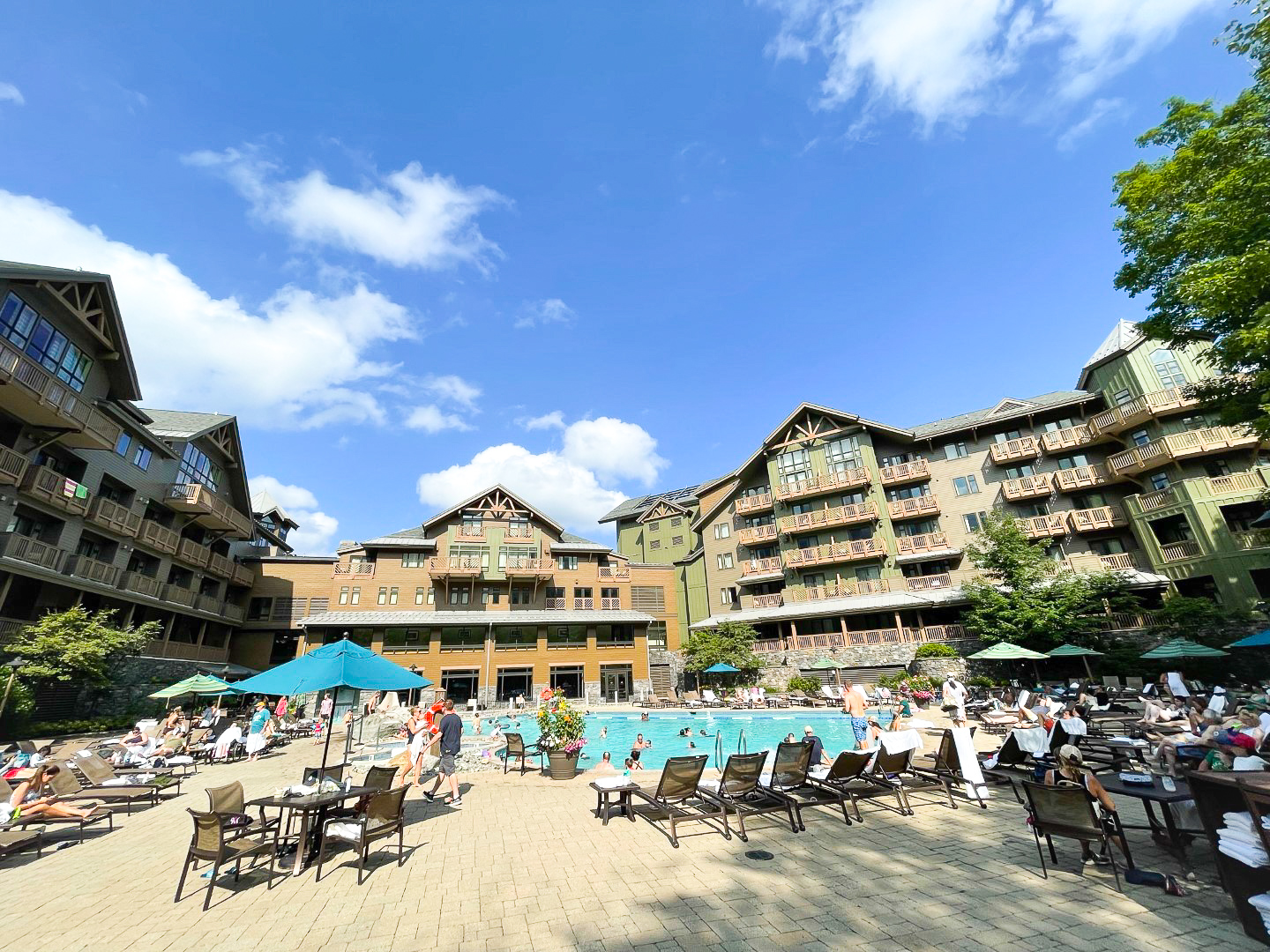 Busy pool at The Lodge at Spruce Peak Destination by Hyatt Stowe Vermont