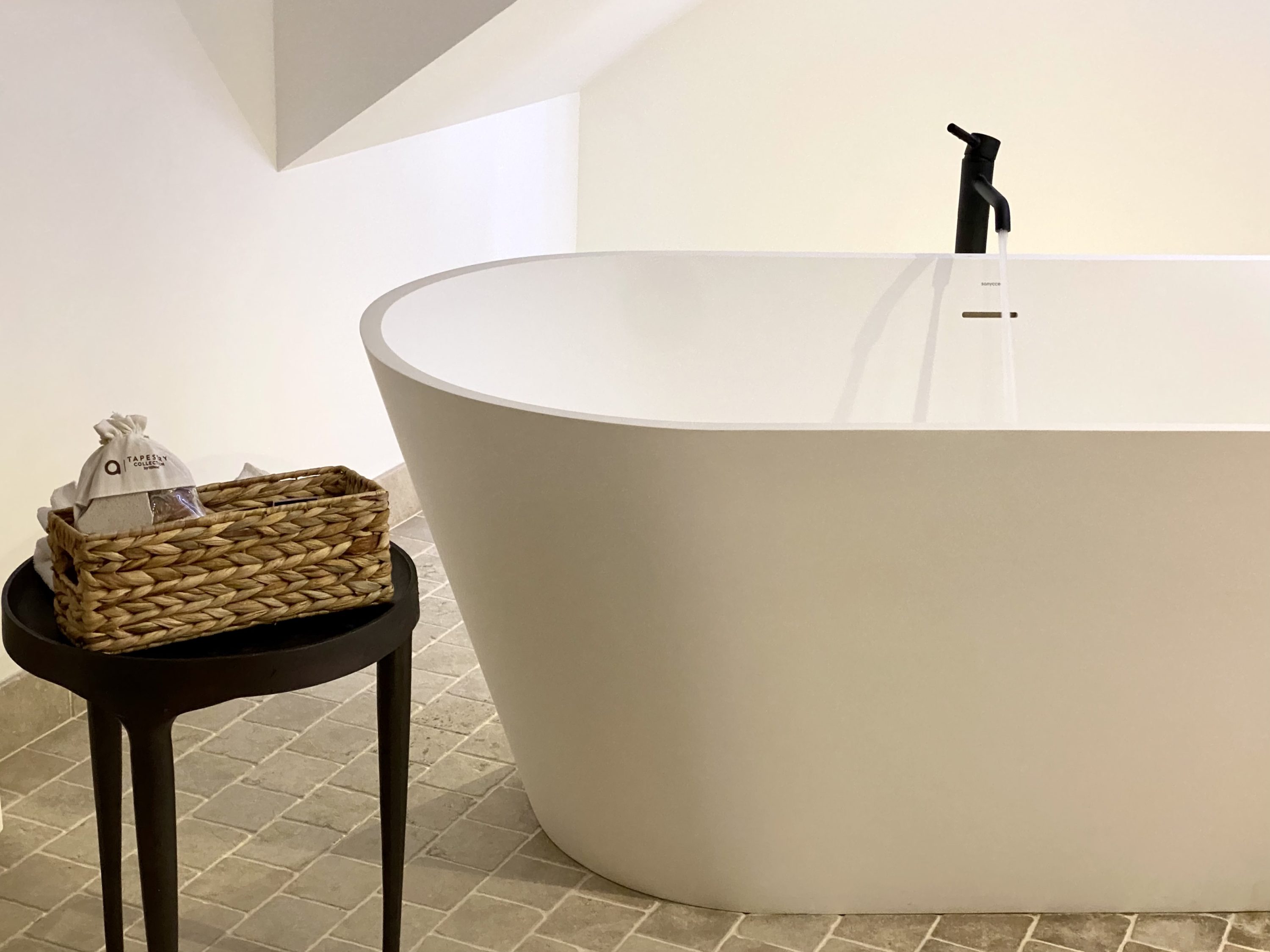 The Atocha Hotel Madrid Tapestry Collection by Hilton bath running in the Atochal Penthouse
