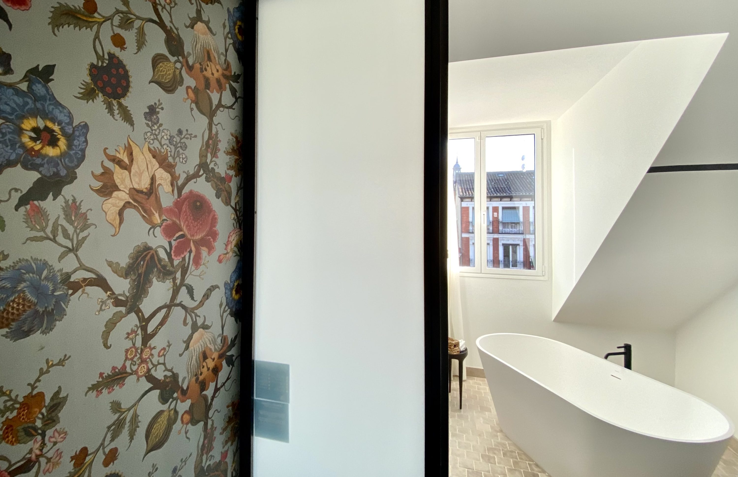 The Atocha Hotel Madrid Tapestry Collection by Hilton El Atochal Penthouse floral wallpaper and bathtub