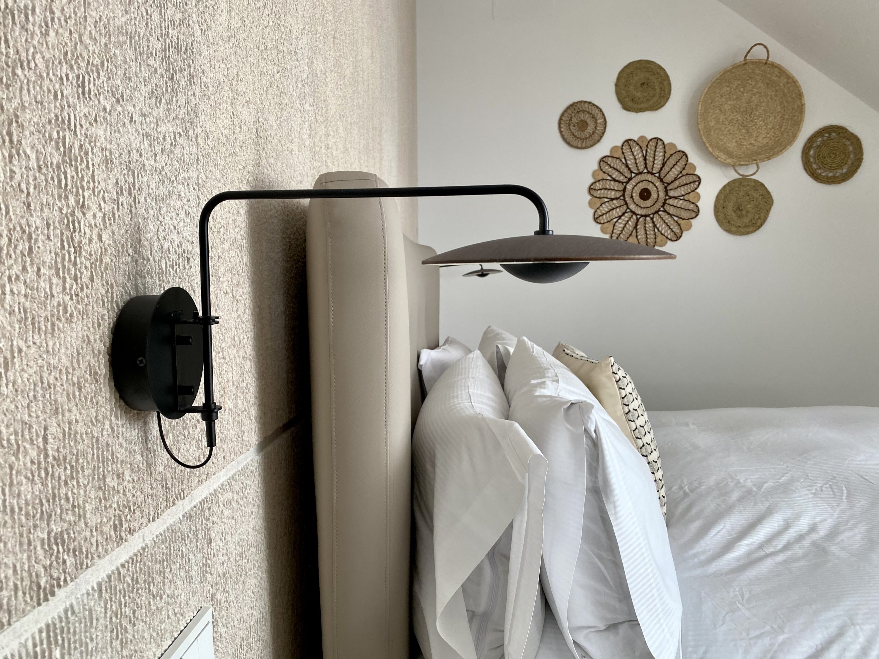 The Atocha Hotel Madrid Tapestry Collection by Hilton El Atochal Penthouse side view of bed