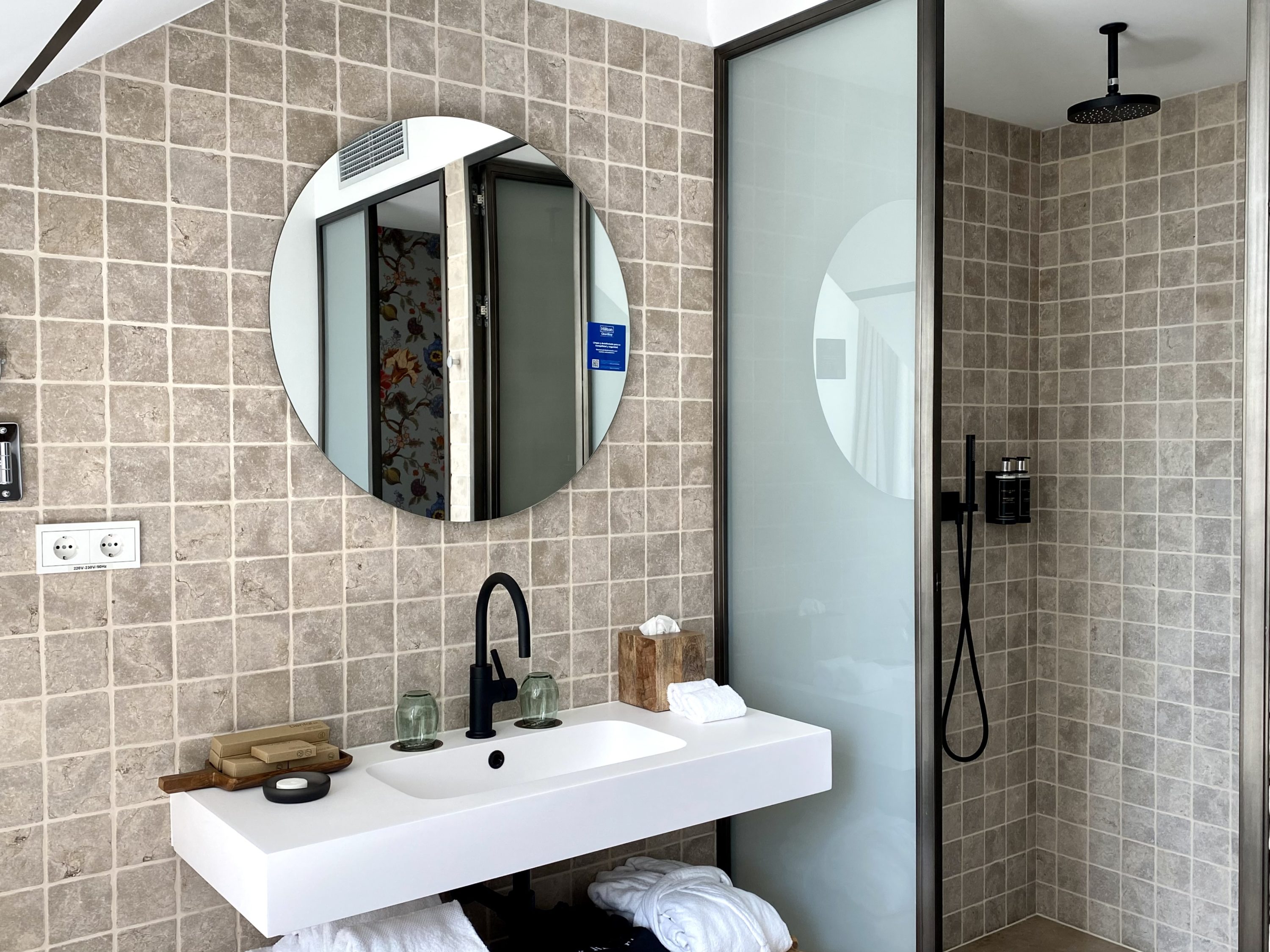 The Atocha Hotel Madrid Tapestry Collection by Hilton El Atochal Penthouse sink area and shower room