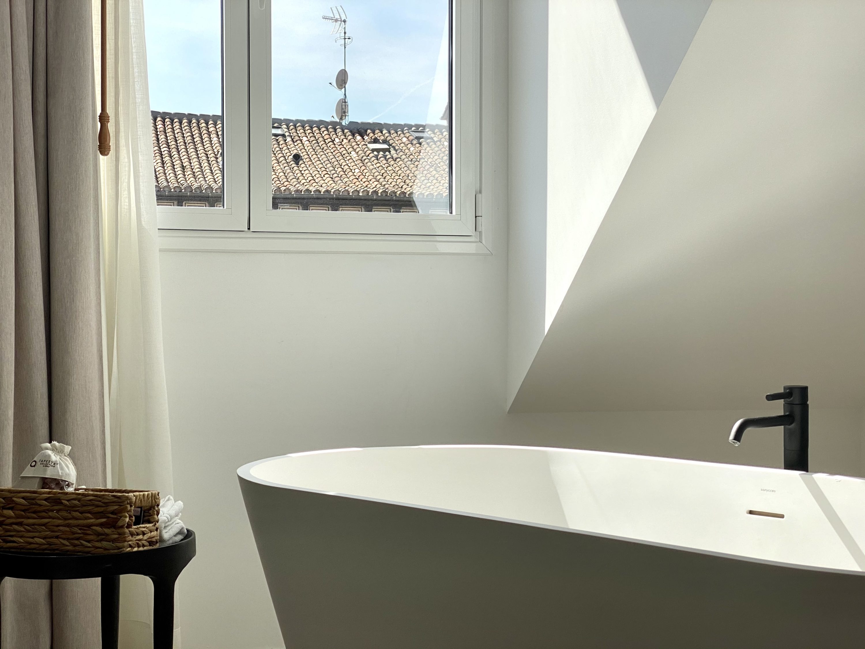 The Atocha Hotel Madrid Tapestry Collection by Hilton El Atochal Penthouse the tub in the sunlight