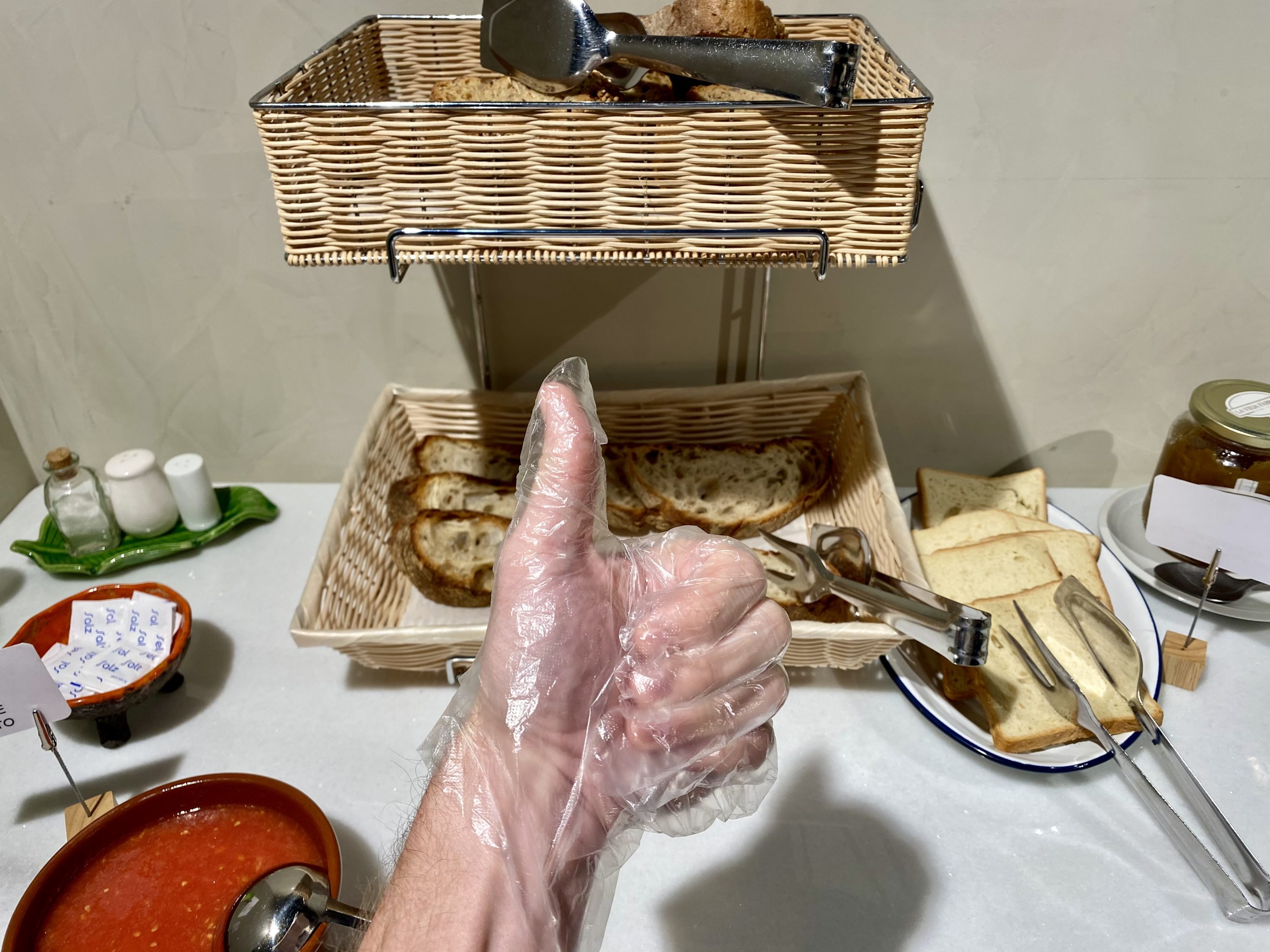 The Atocha Hotel Madrid Tapestry Collection by Hilton plastic gloves at breakfast